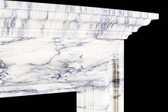 A Baroque Regency Bolection Fireplace with Shelf in Italian Pavonazzo Marble