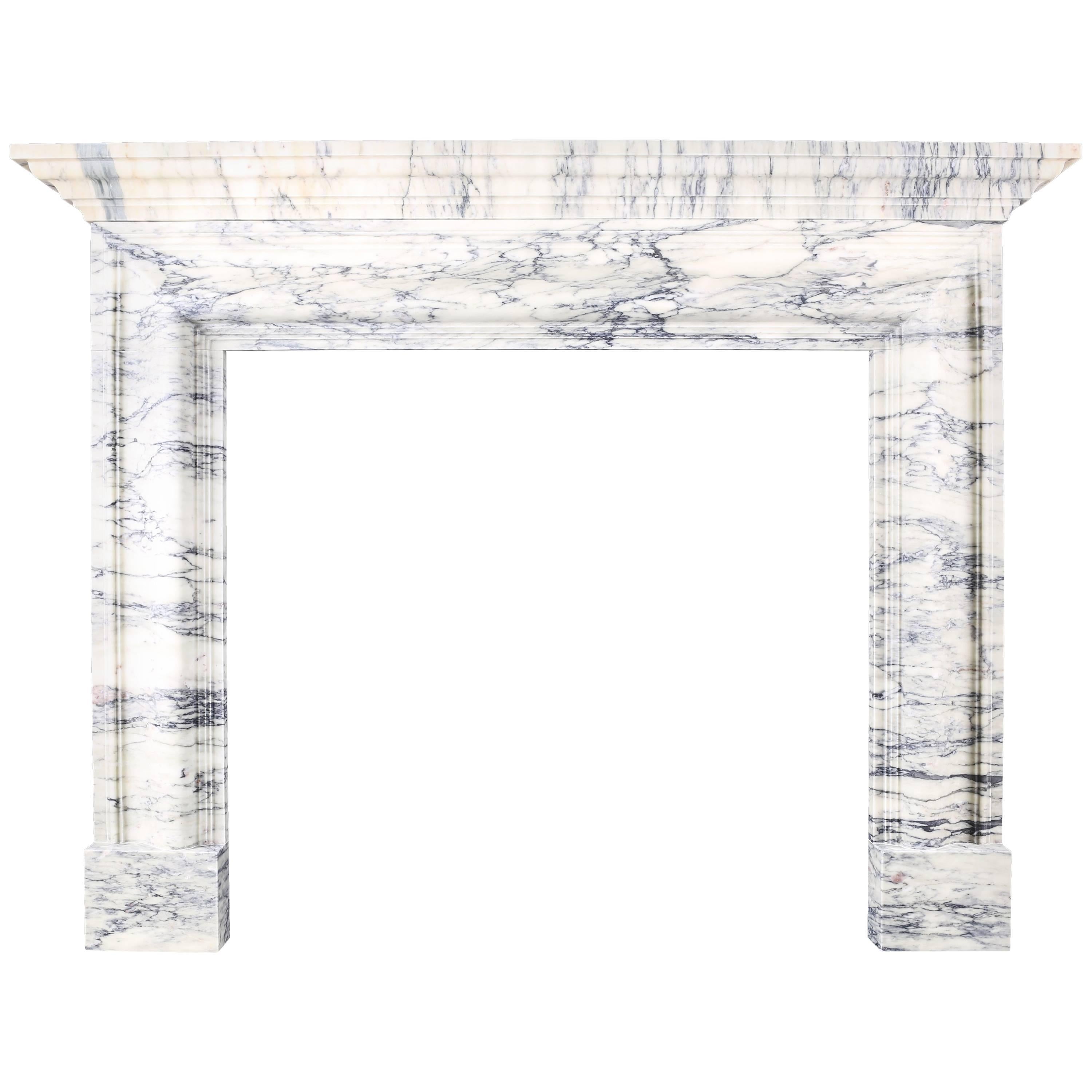 A Baroque Regency Bolection Fireplace with Shelf in Italian Pavonazzo Marble For Sale