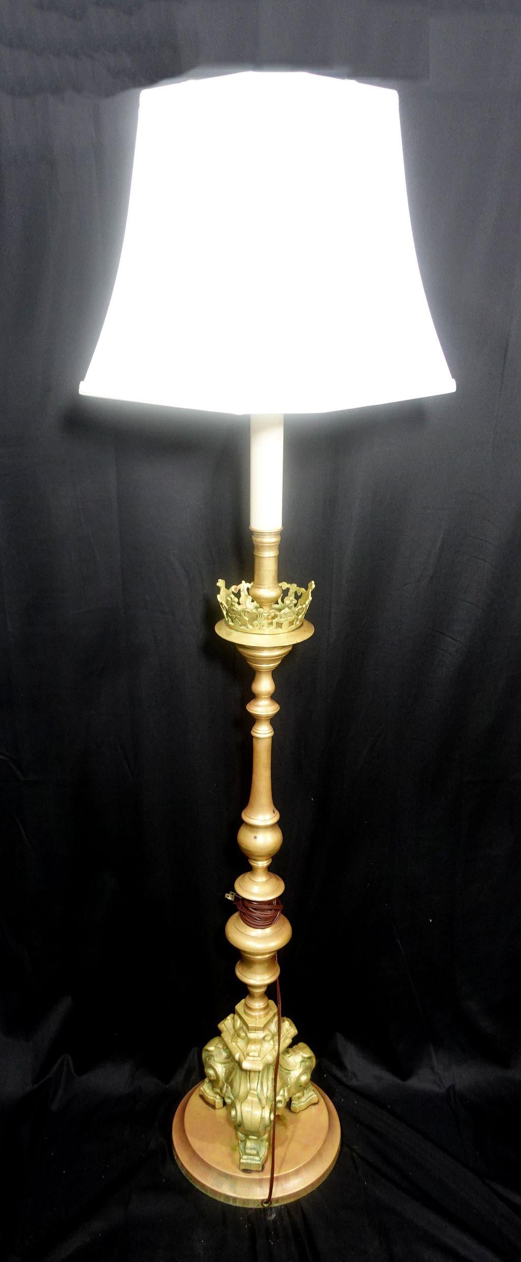 A Heavy Baroque Revival brass floor lamp in the form of an alter candlestick.



 