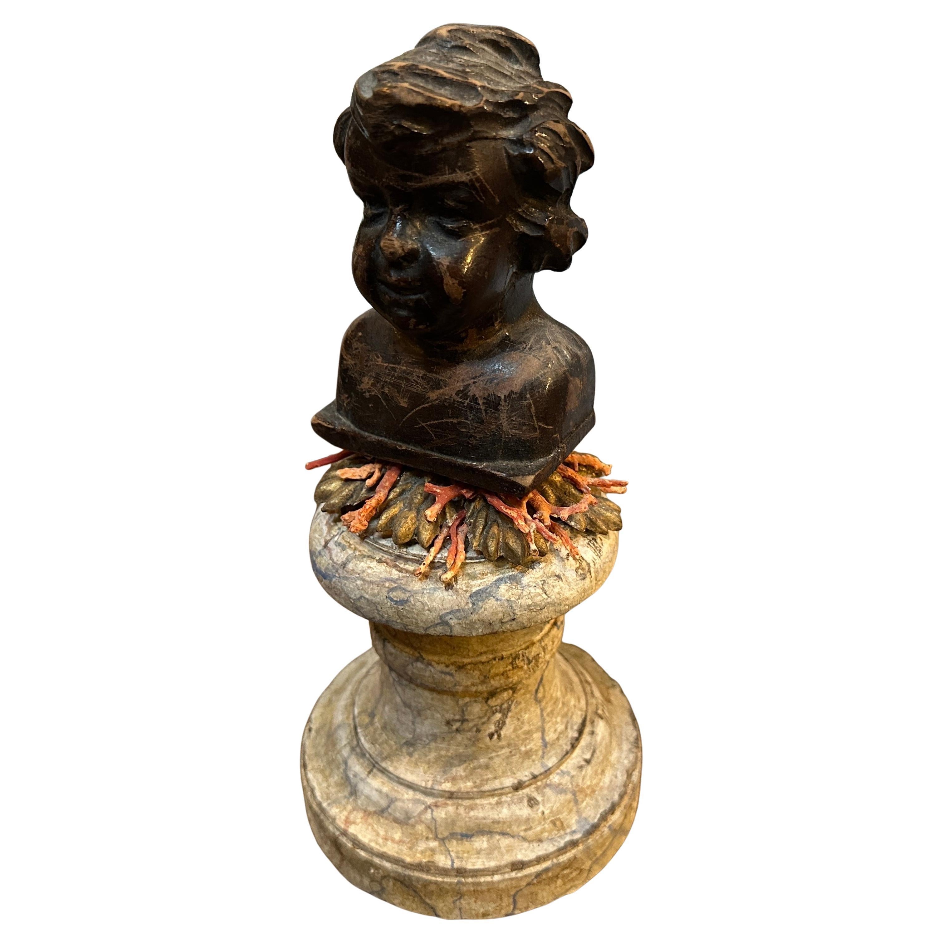 Baroque Revival Wood Bust of a Putto on Faux Marble Lacquered Base – 19th Century
A charming and soulful 19th-century Baroque Revival carved wood bust depicting a cherubic putto. This beautifully aged sculpture features rich detailing in the facial