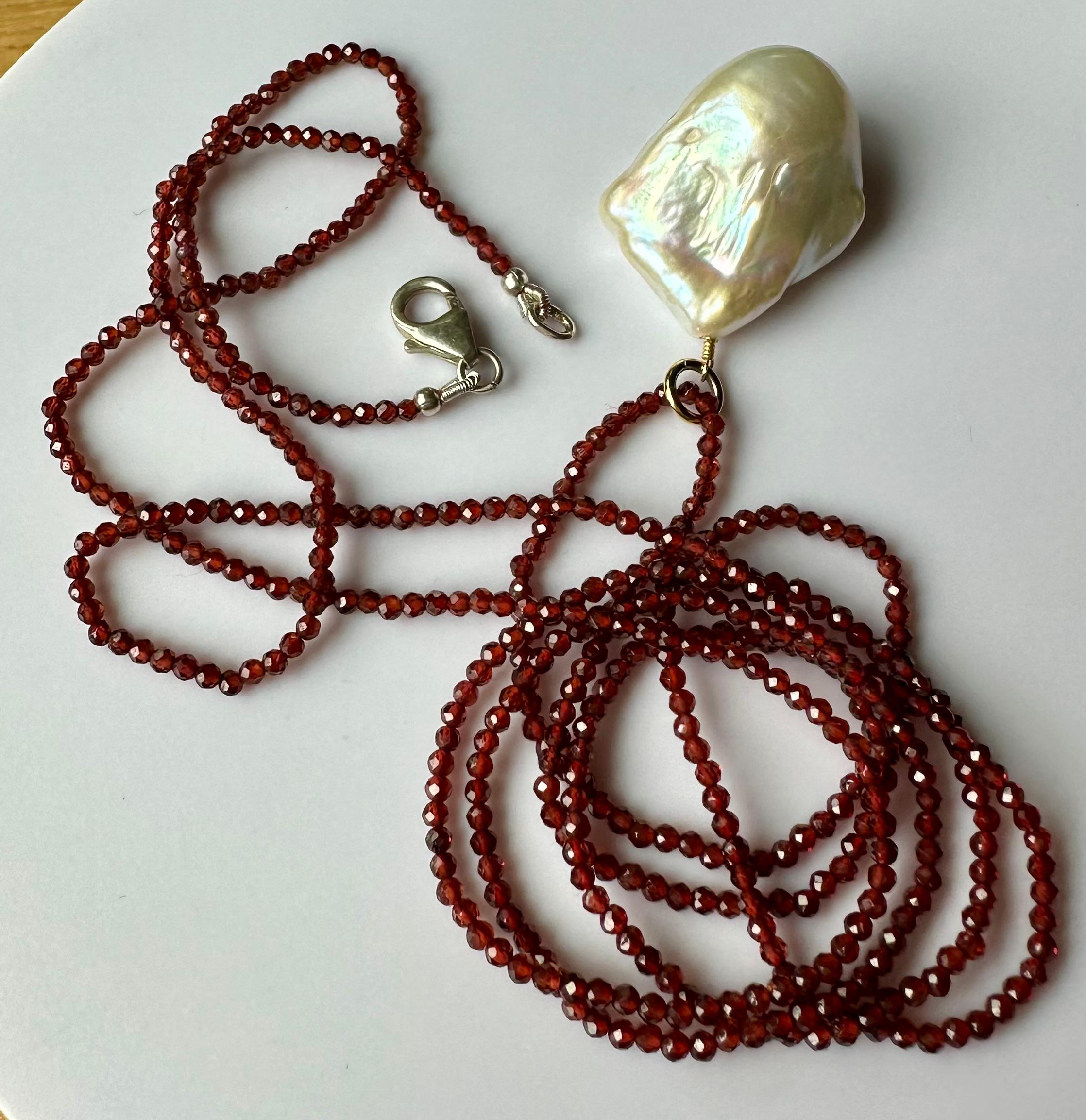 A Baroque South Sea Pearl Pendant hanging from a 24 Inch Beaded Garnet Necklace In New Condition For Sale In Coupeville, WA