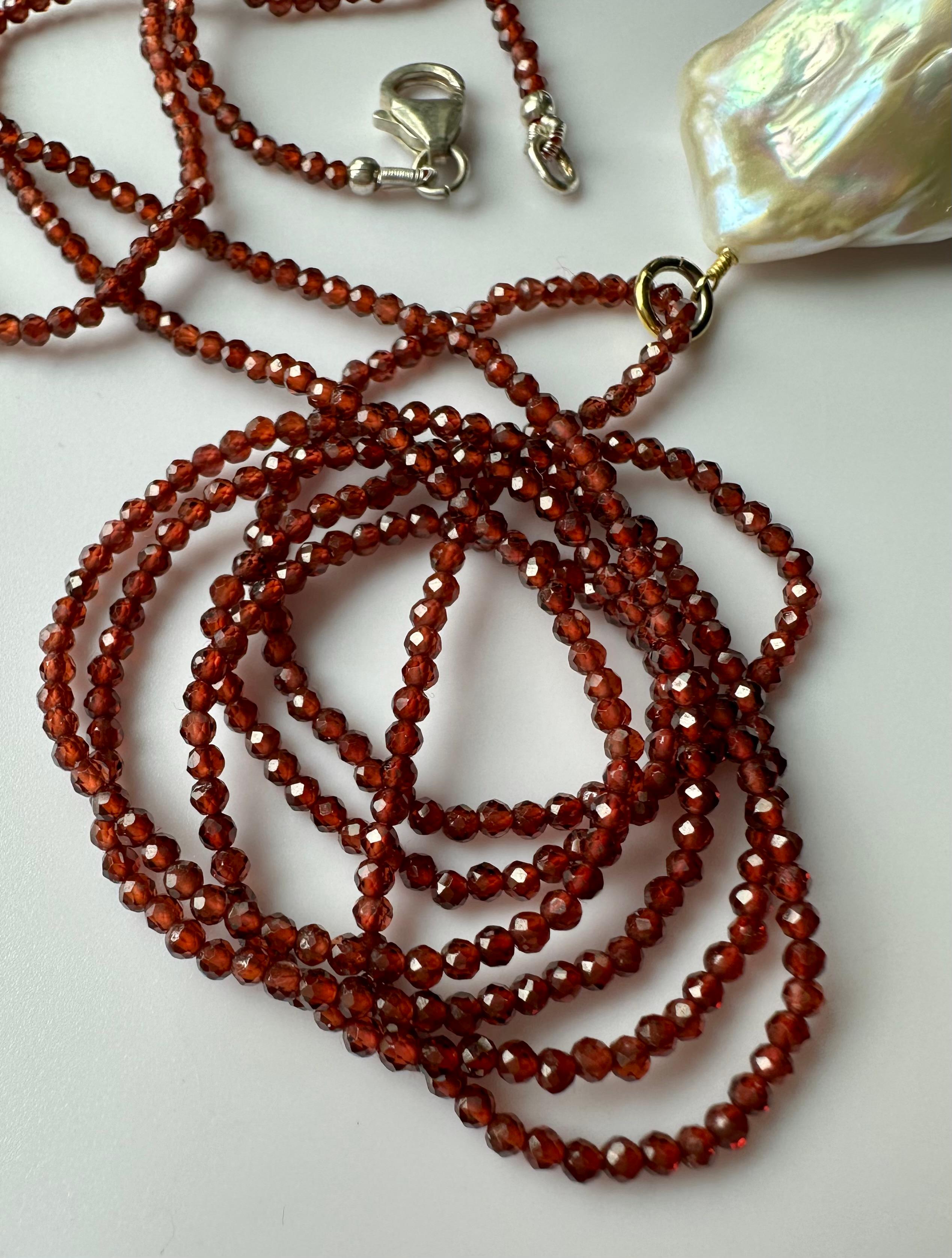 Women's A Baroque South Sea Pearl Pendant hanging from a 24 Inch Beaded Garnet Necklace For Sale