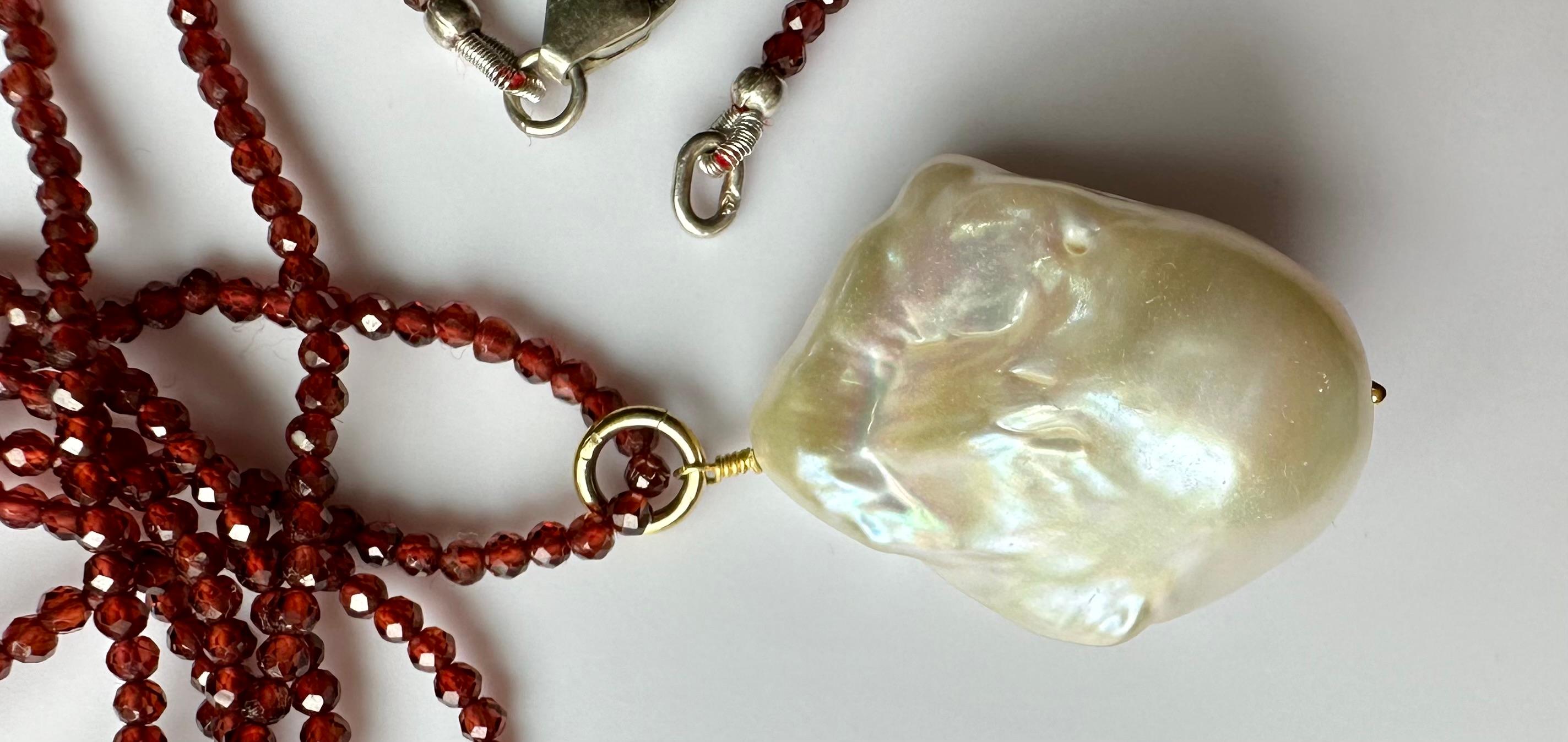 A Baroque South Sea Pearl Pendant hanging from a 24 Inch Beaded Garnet Necklace For Sale 1