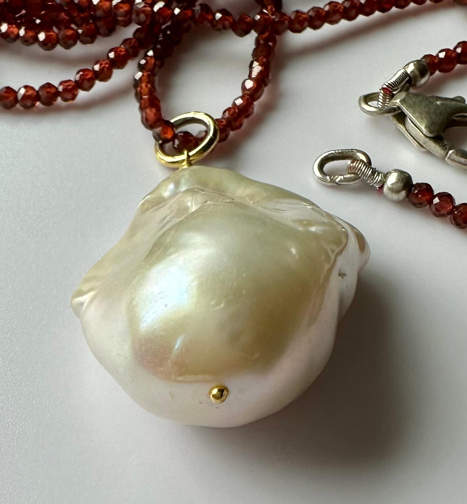 A Baroque South Sea Pearl Pendant hanging from a 24 Inch Beaded Garnet Necklace For Sale 2