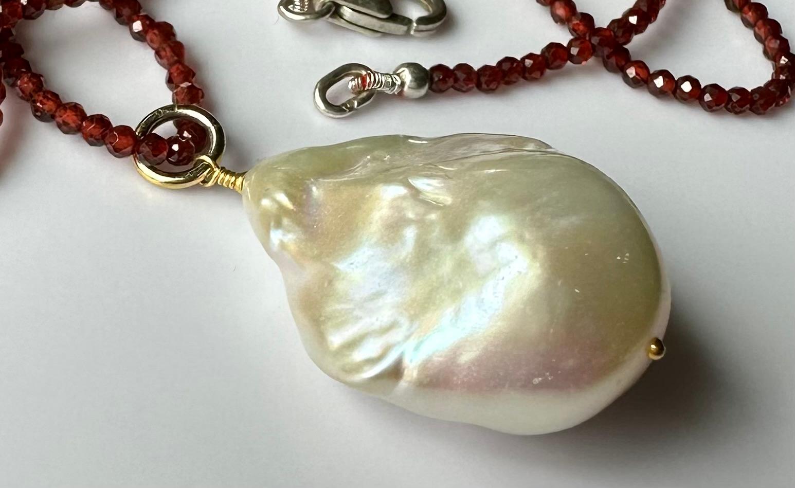 A Baroque South Sea Pearl Pendant hanging from a 24 Inch Beaded Garnet Necklace For Sale 4