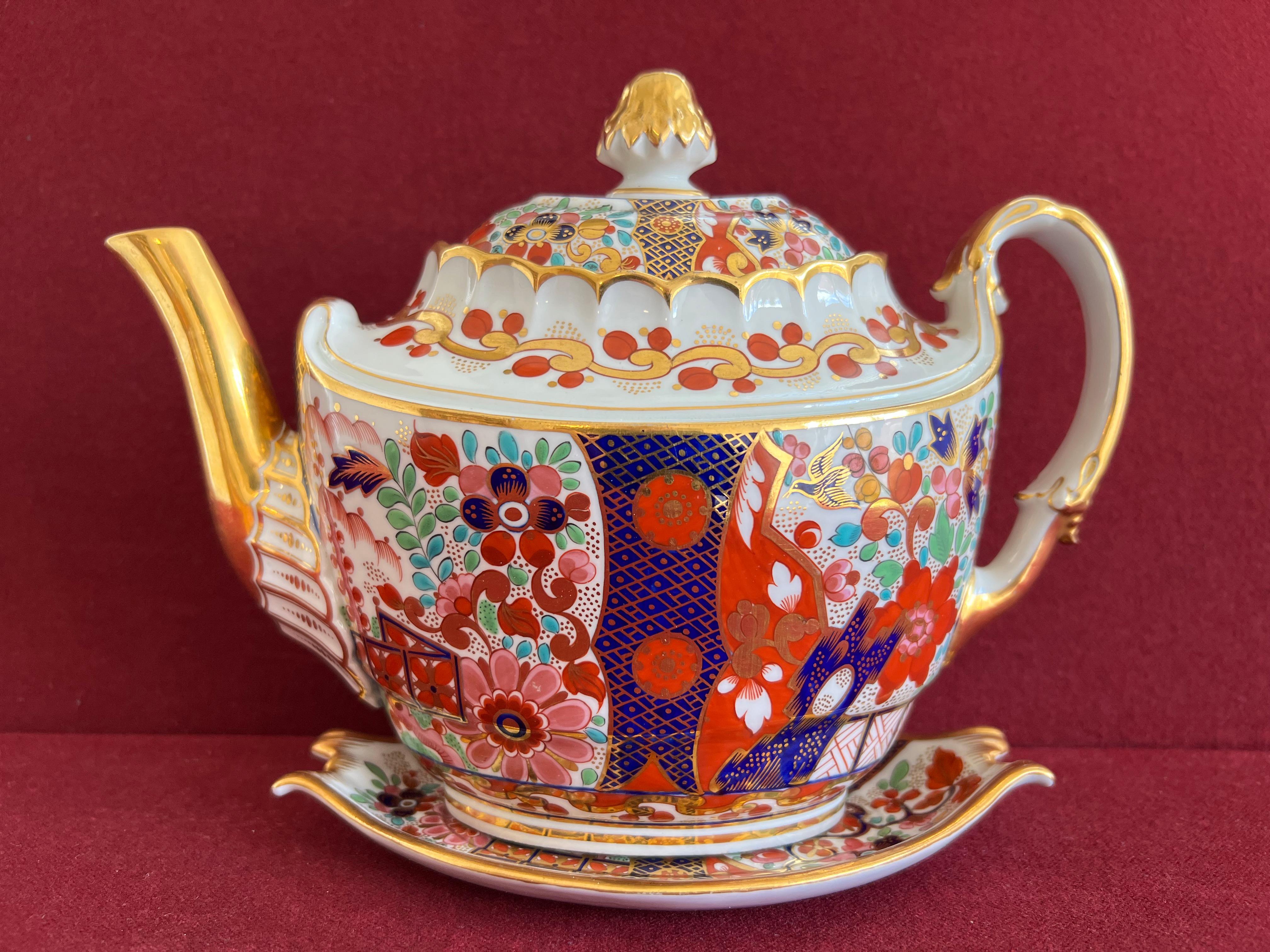 A barr flight and barr worcester porcelain teapot and stand c.1810. Finely decorated with a bold Japan pattern.

Condition: The teapot is in good condition, save for two small chips to the inner flange of the cover, one of which is associated to a