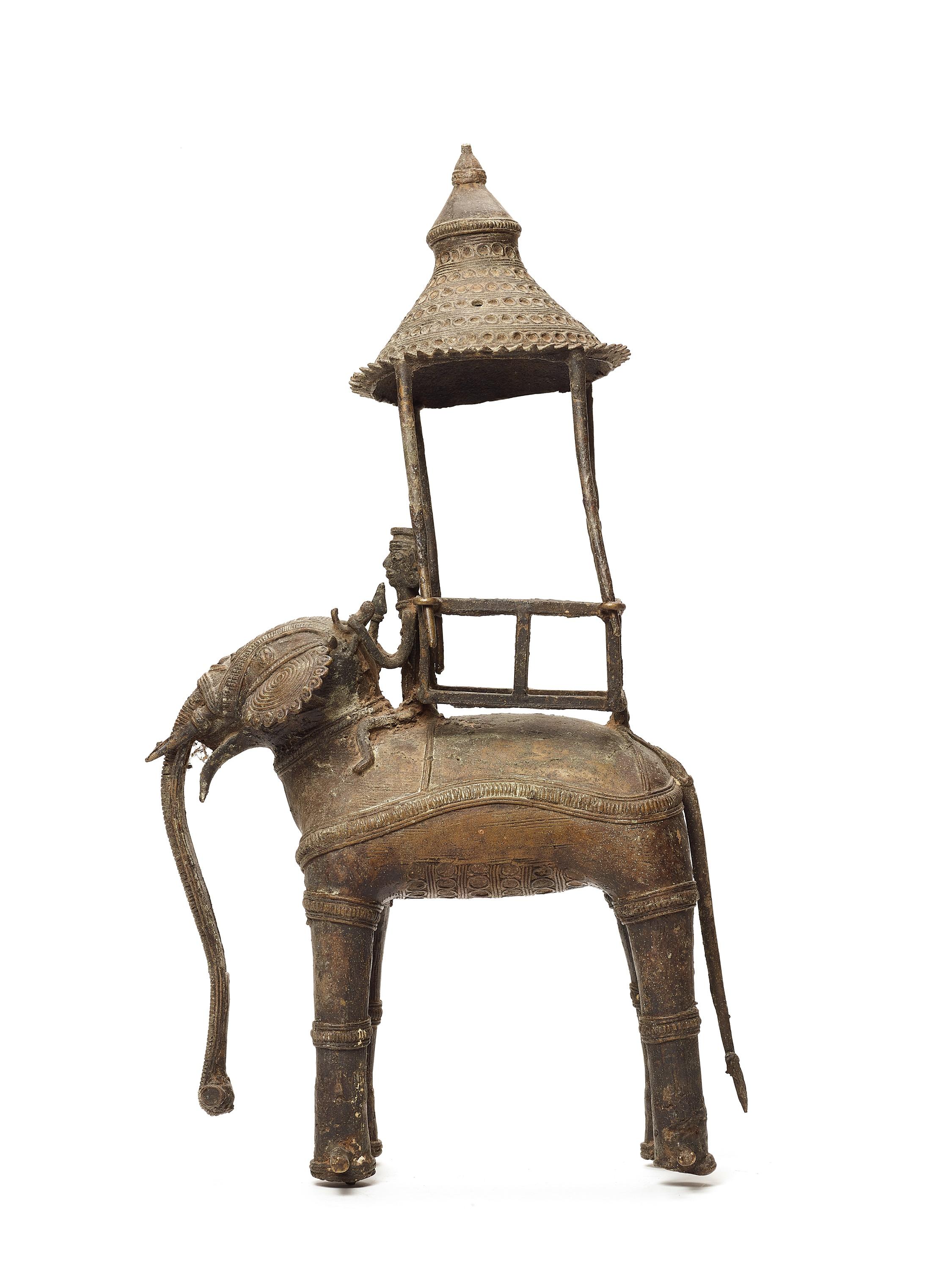 A bastar bronze of an elephant with Howdah, india, 19th-20th century

This very large figure of elephant consists of two parts, the elephant itself and the umbrella with a lotus bud on top. The head of the elephant is remarkably well decorated