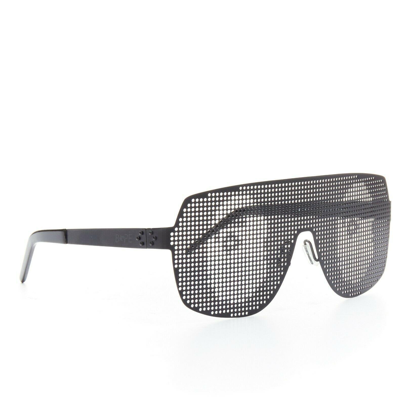A BATHING APE BAPE black metal dotted shutter shades kanye sunglasses logo print

Designer: A BATHING APE (BAPE)
Model / Season: N/A
Material: metal
Colour: charcoal blackPattern: dotted
Description: Dotted shutter shades. Printed brand symbol on