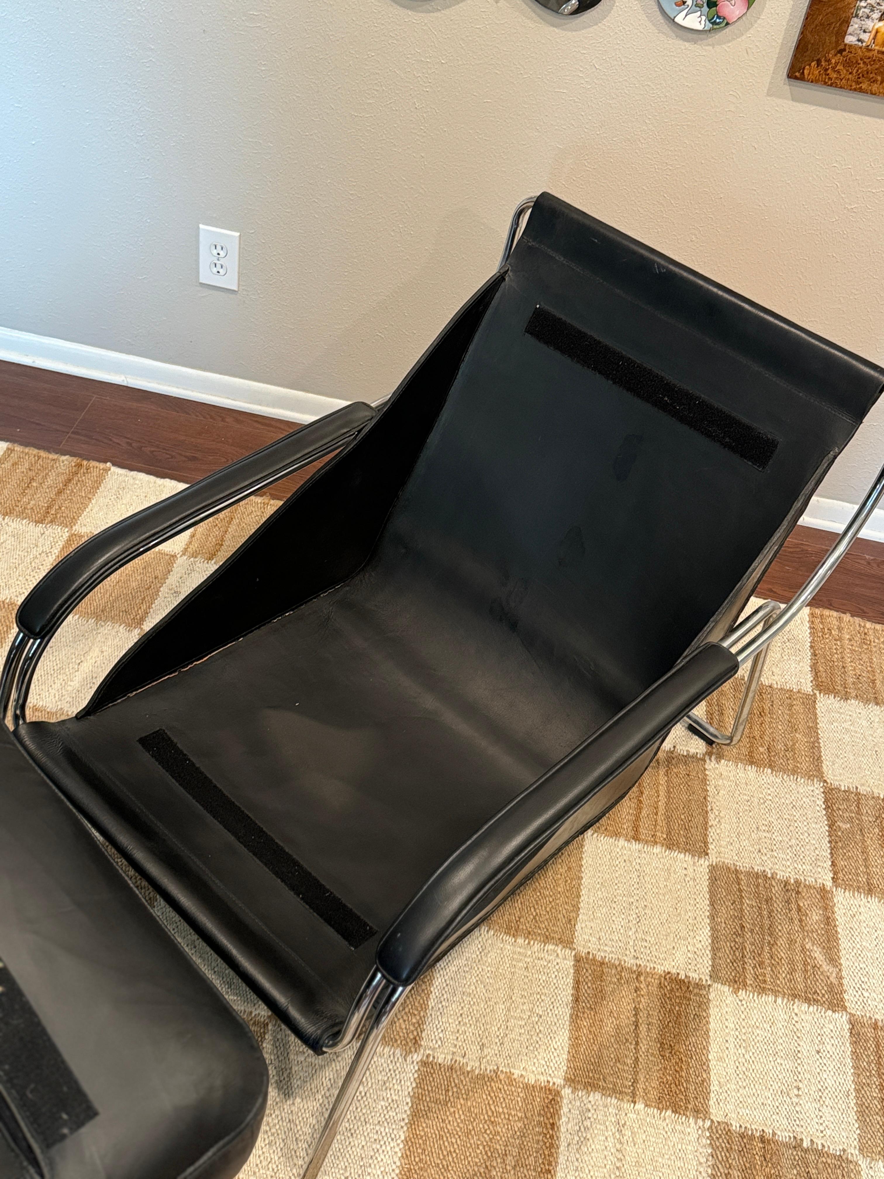 A bauhaus style black leather and chrome lounge chair and ottoman 2