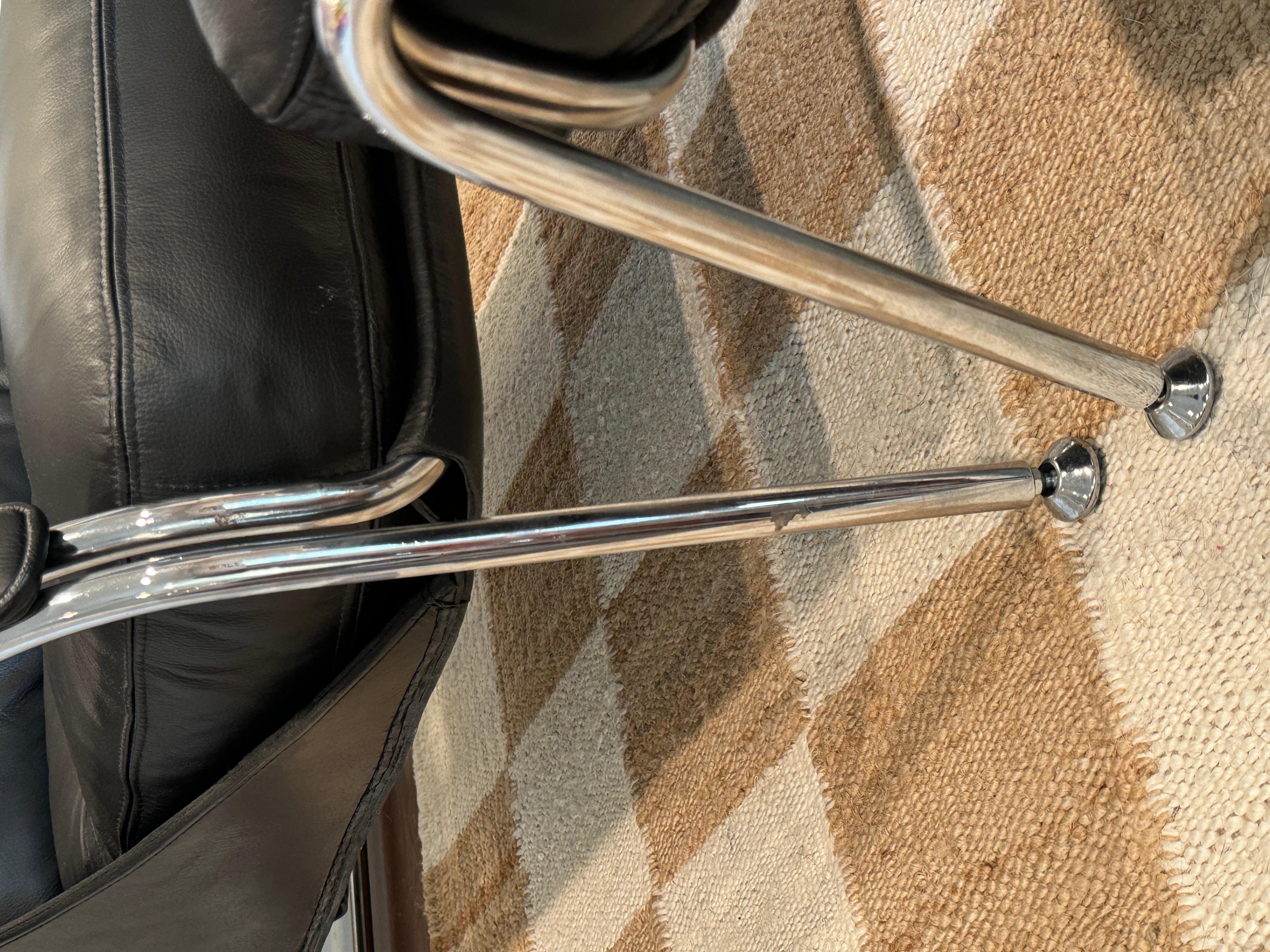 A bauhaus style black leather and chrome lounge chair and ottoman 3