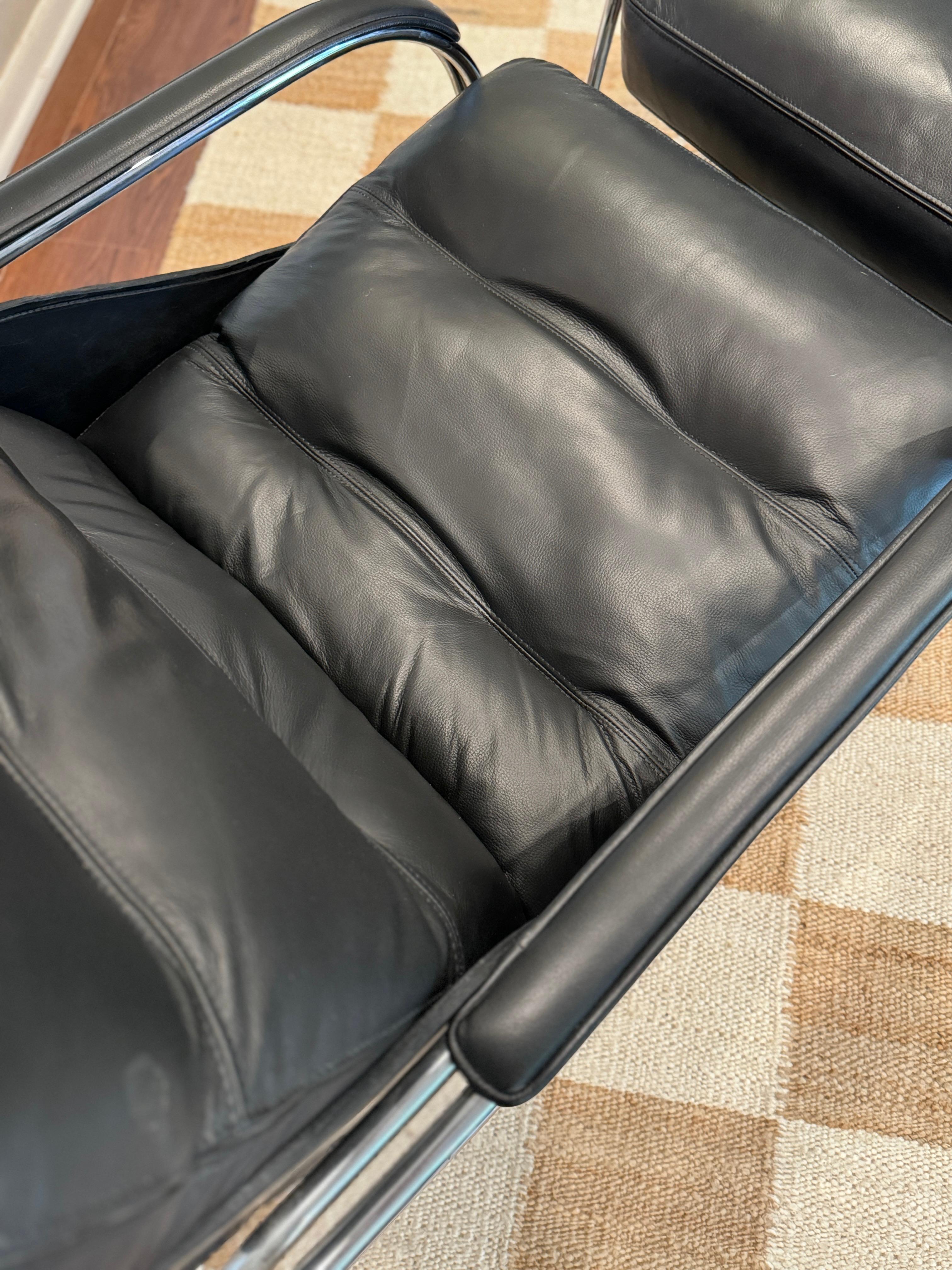 A bauhaus style black leather and chrome lounge chair and ottoman 4