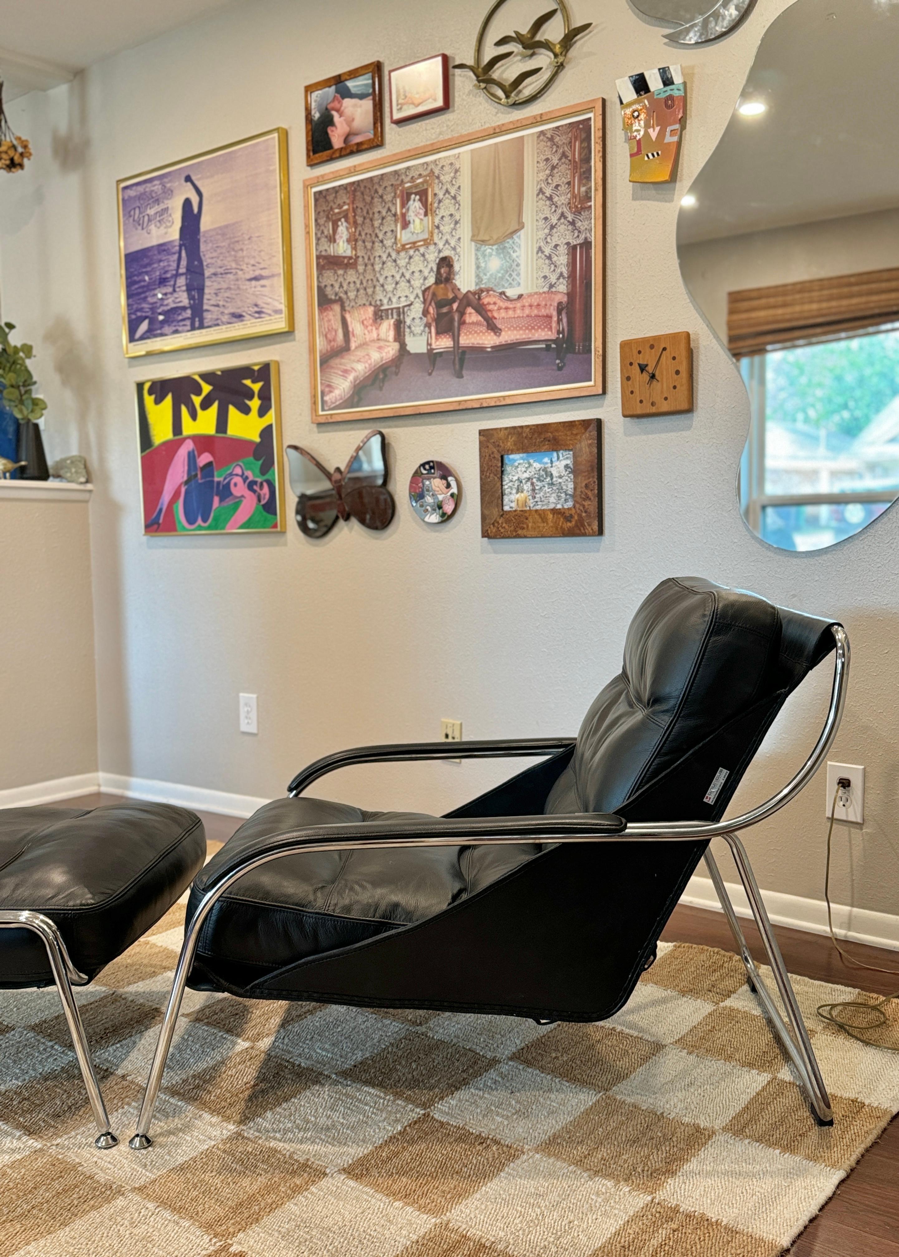 A bauhaus style black leather and chrome lounge chair and ottoman 8