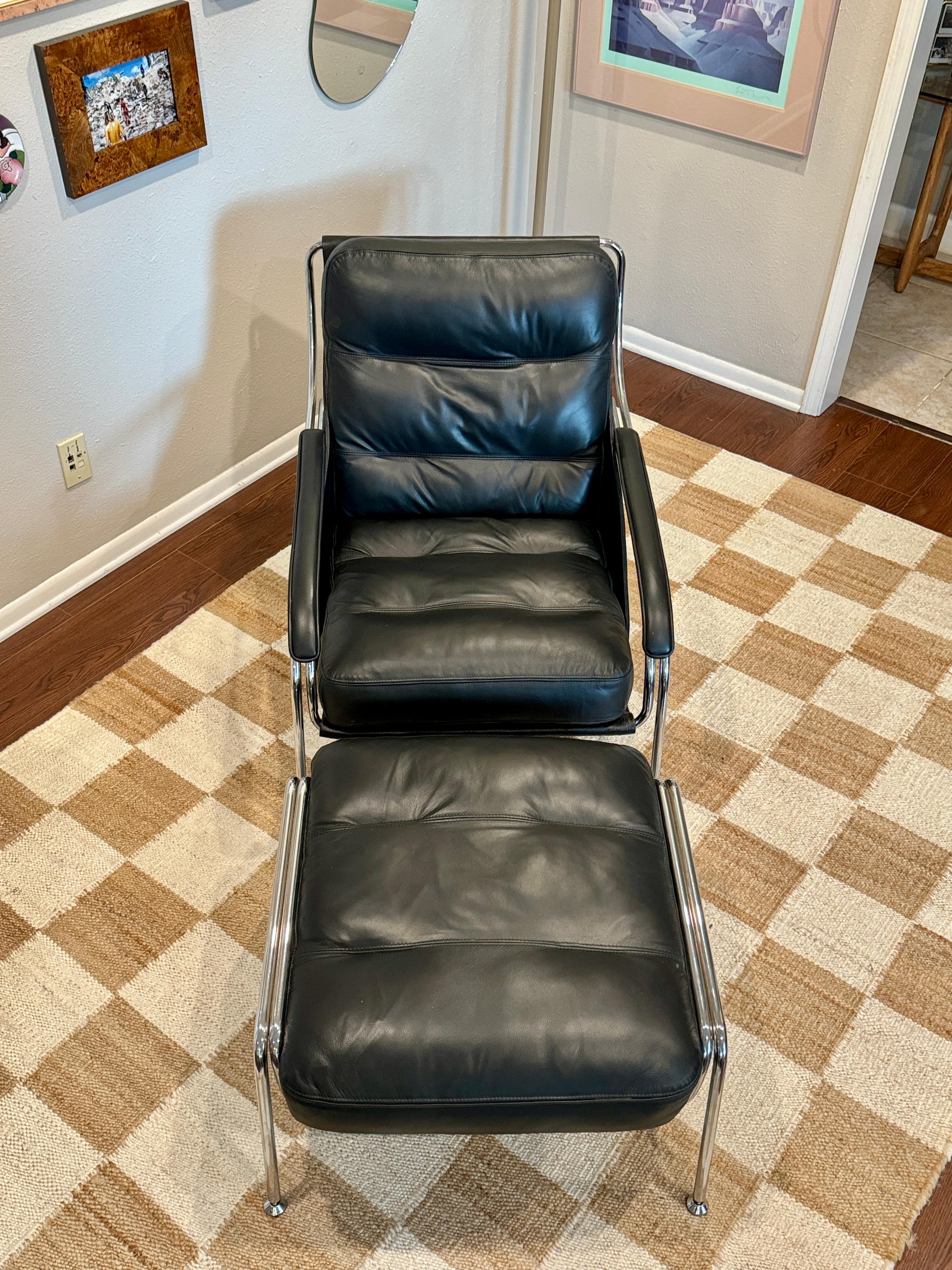 A bauhaus style black leather and chrome lounge chair and ottoman 12