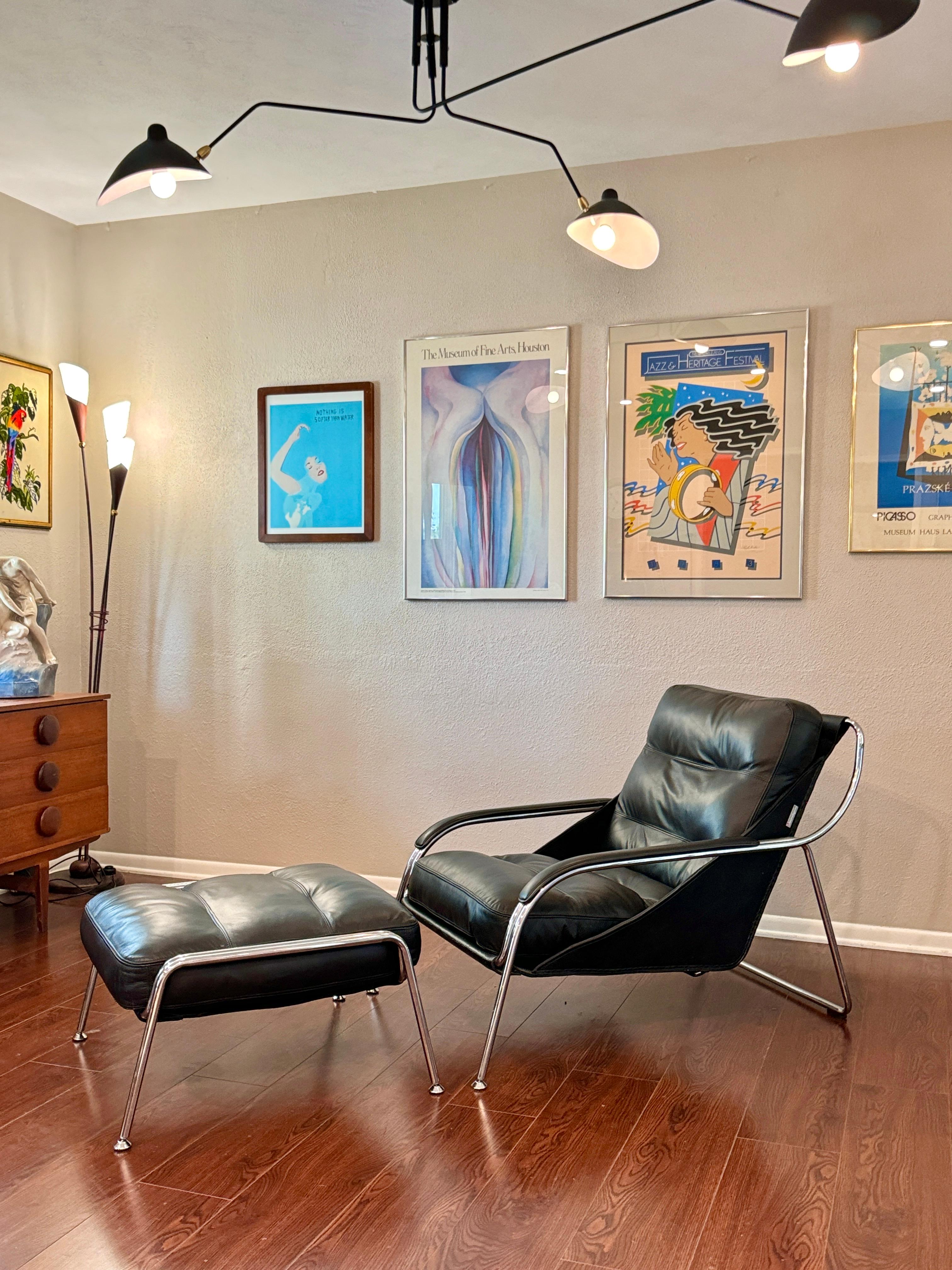 Leather A bauhaus style black leather and chrome lounge chair and ottoman