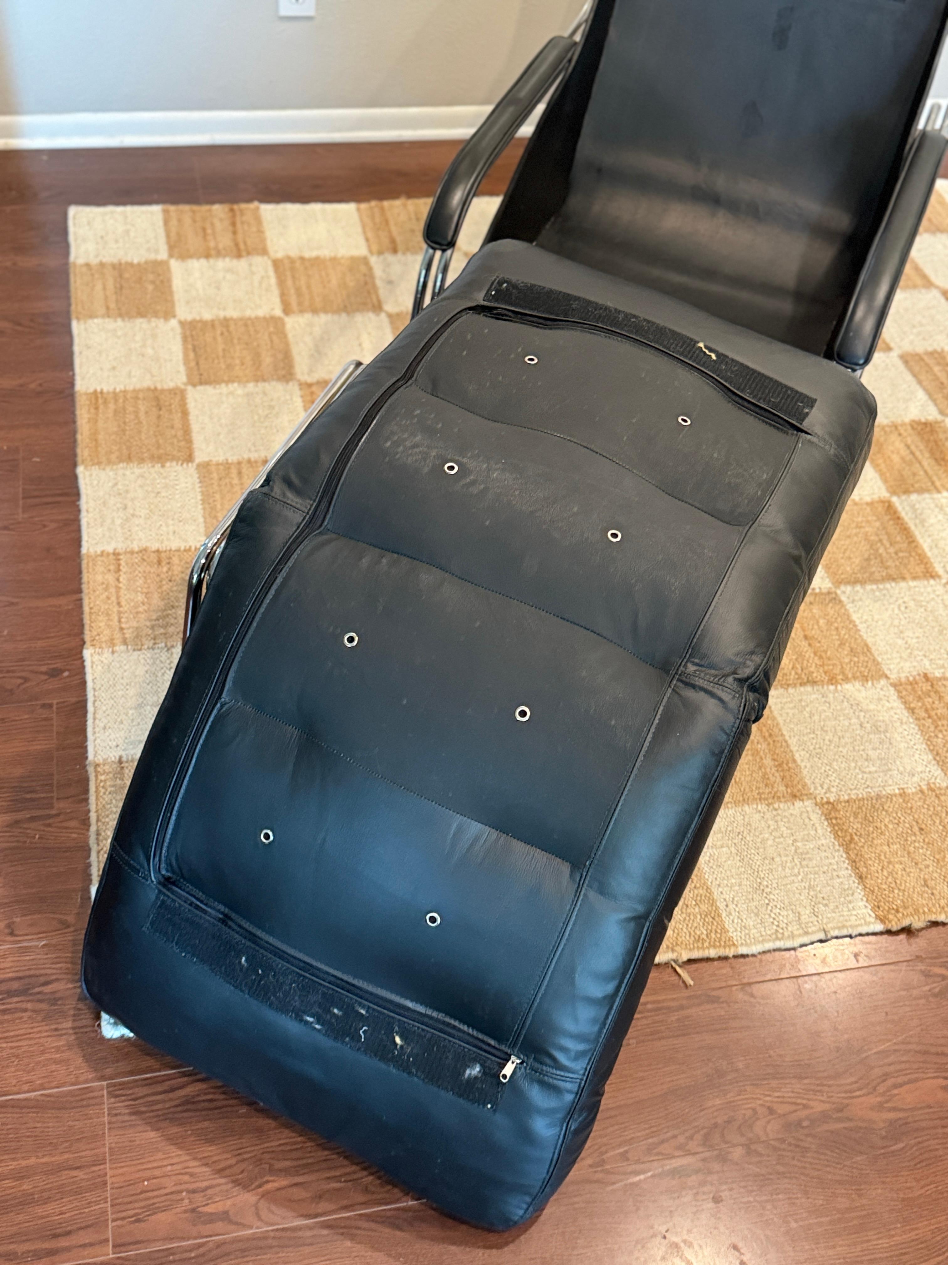 A bauhaus style black leather and chrome lounge chair and ottoman 1