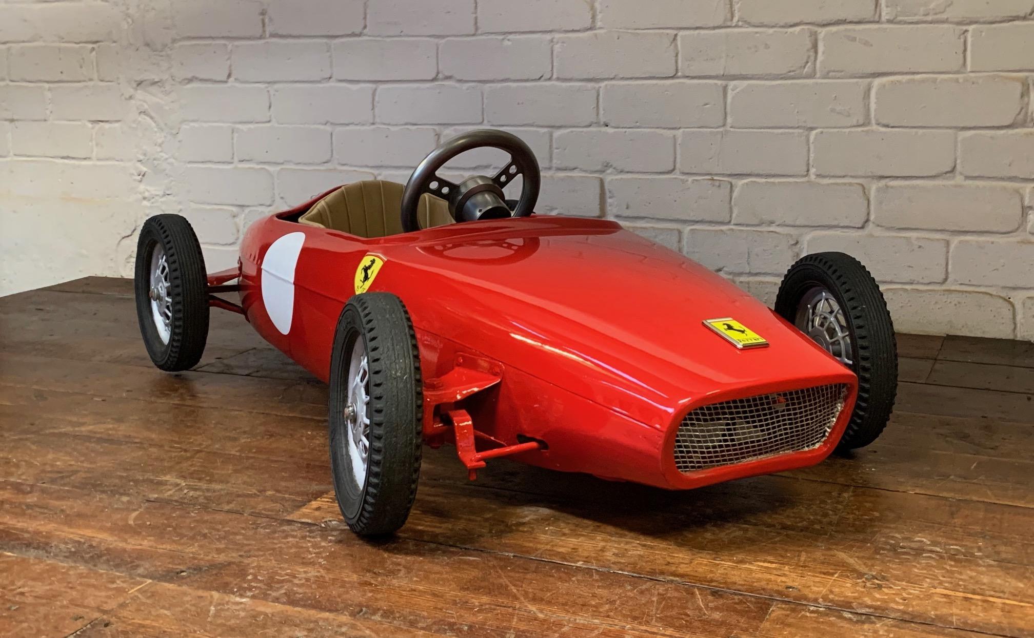 A Beautiful 1960’s Ferrari F1 Pedal Car by Morellet et Guérineau, Belissima!

This pedal car is a bit of a stunner, based on the Ferrari 156F1 racing version, it has been fully restored to its former glory and was a very rare barn find. The body and