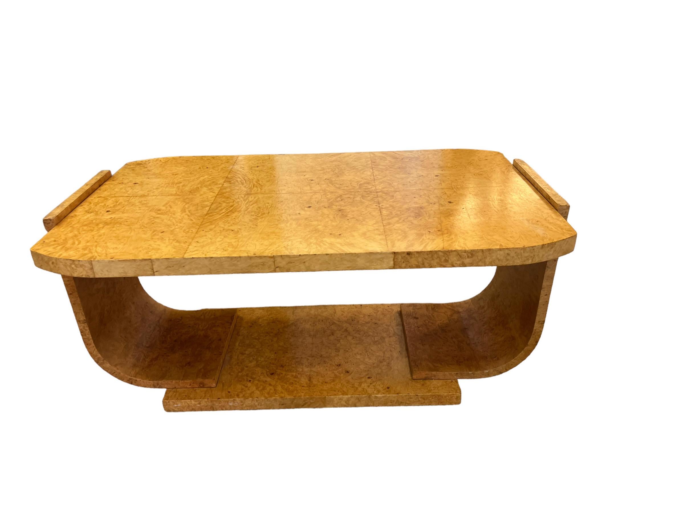 A beautiful and extremely well made original Art Deco period coffee table in maple and book matched Burl Veneer. This item has no markers mark but in the style of Harry & Lou Epstein 1920-1930s.

Dimensions  41.5W 24D 19H