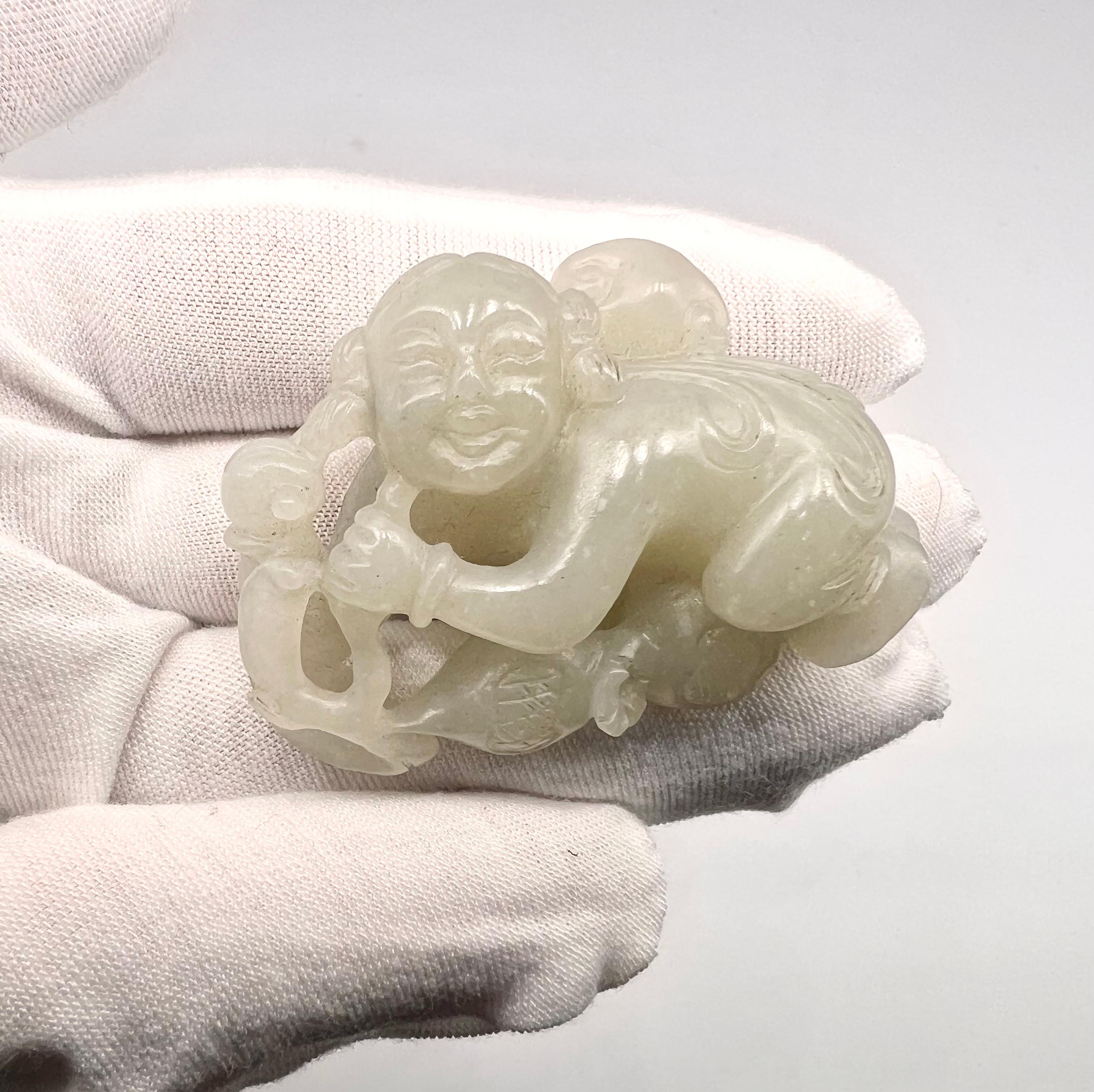 A beautiful Antique chinese white jade open work pendant/carving. 



A magnificent Open work White Nephrite Jade carving of the kneeling boy holding a large lingzhi mushroom.
His round face with fine features set in a merry expression, his head