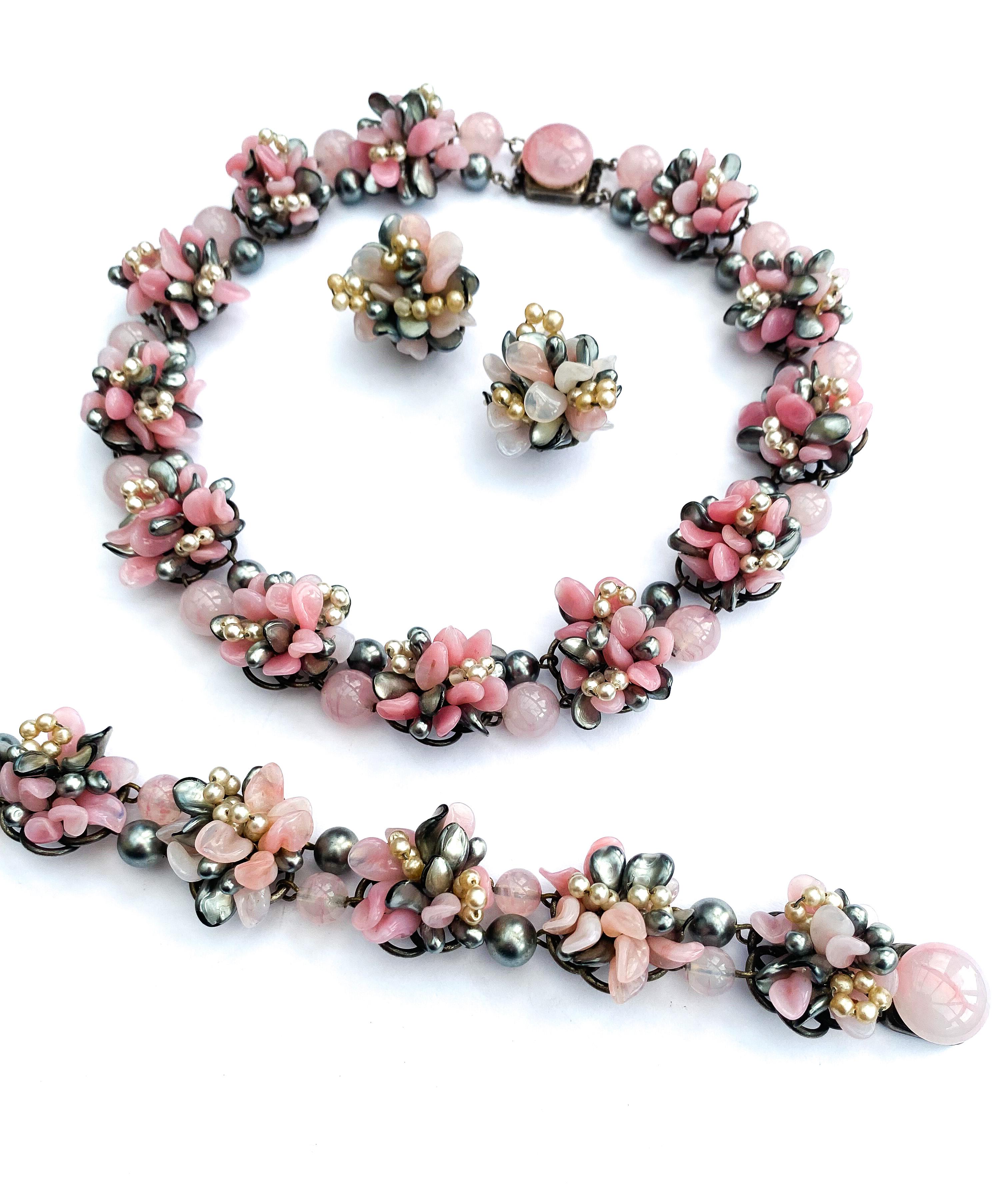 An iconic design from Louis Rousselet, a design that came in several colourways. This is a soft and subtle design, in tones of pink and grey, unusual in that is consists of three pieces (necklace, bracelet and matching earrings). Each piece of glass