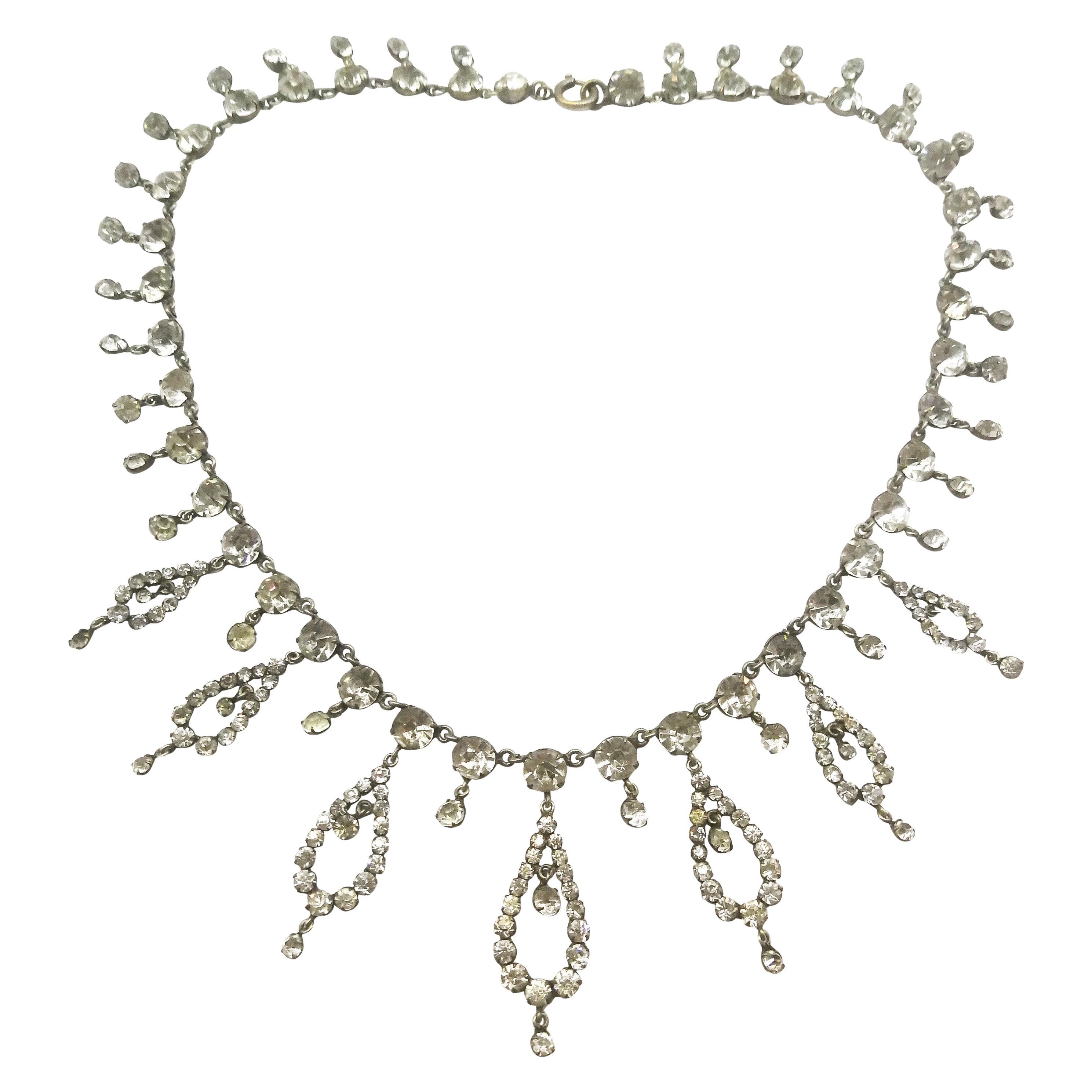 A beautiful clear paste festoon necklace, with graduated drops, French, 1910/20.