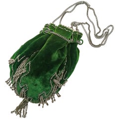 A beautiful deep green velvet and cut steel drawstring handbag, French, 1900s