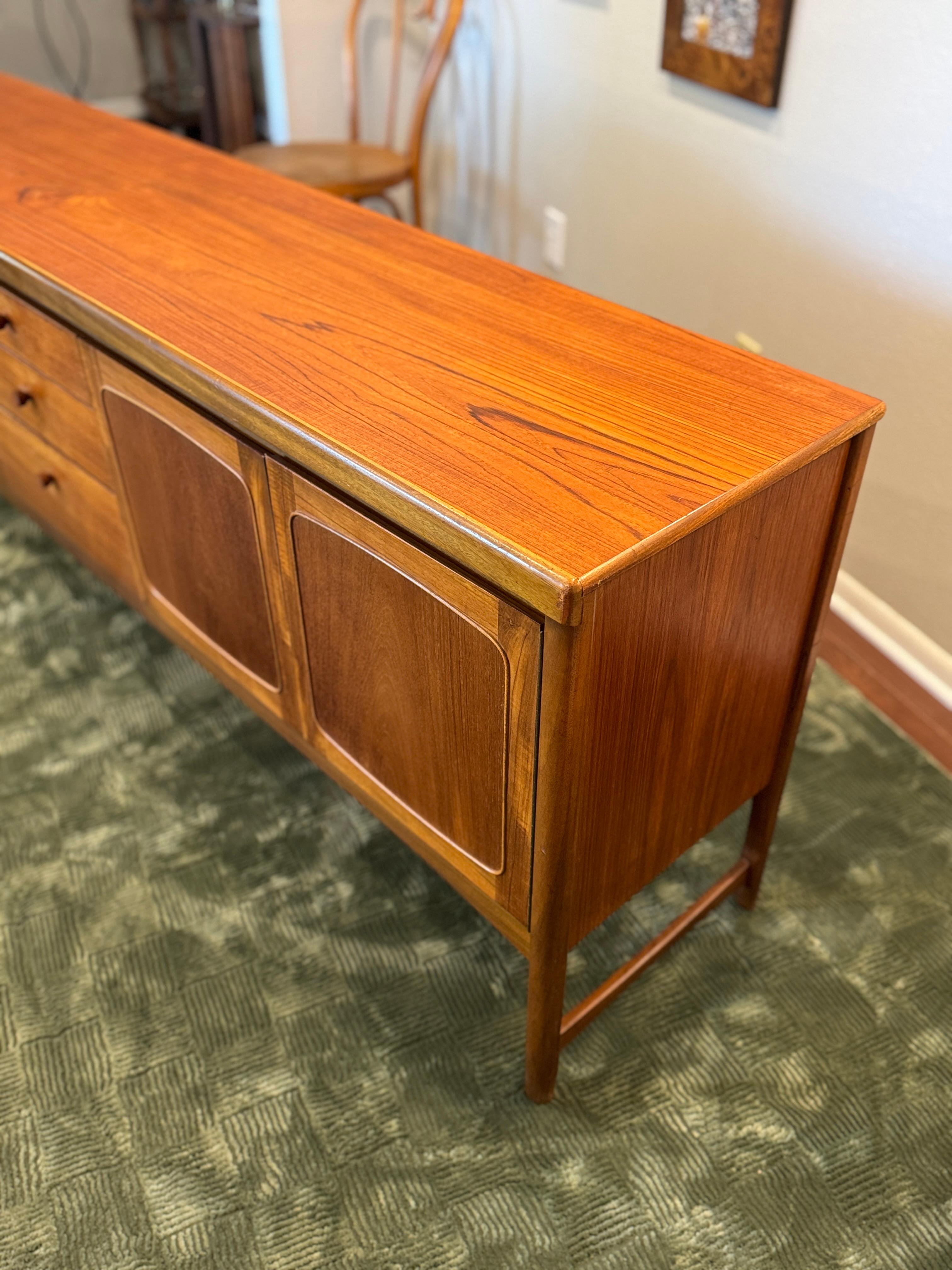 A beautiful, extra long teak sideboard by Nathan Furniture, called “Squares.” In Good Condition For Sale In Houston, TX