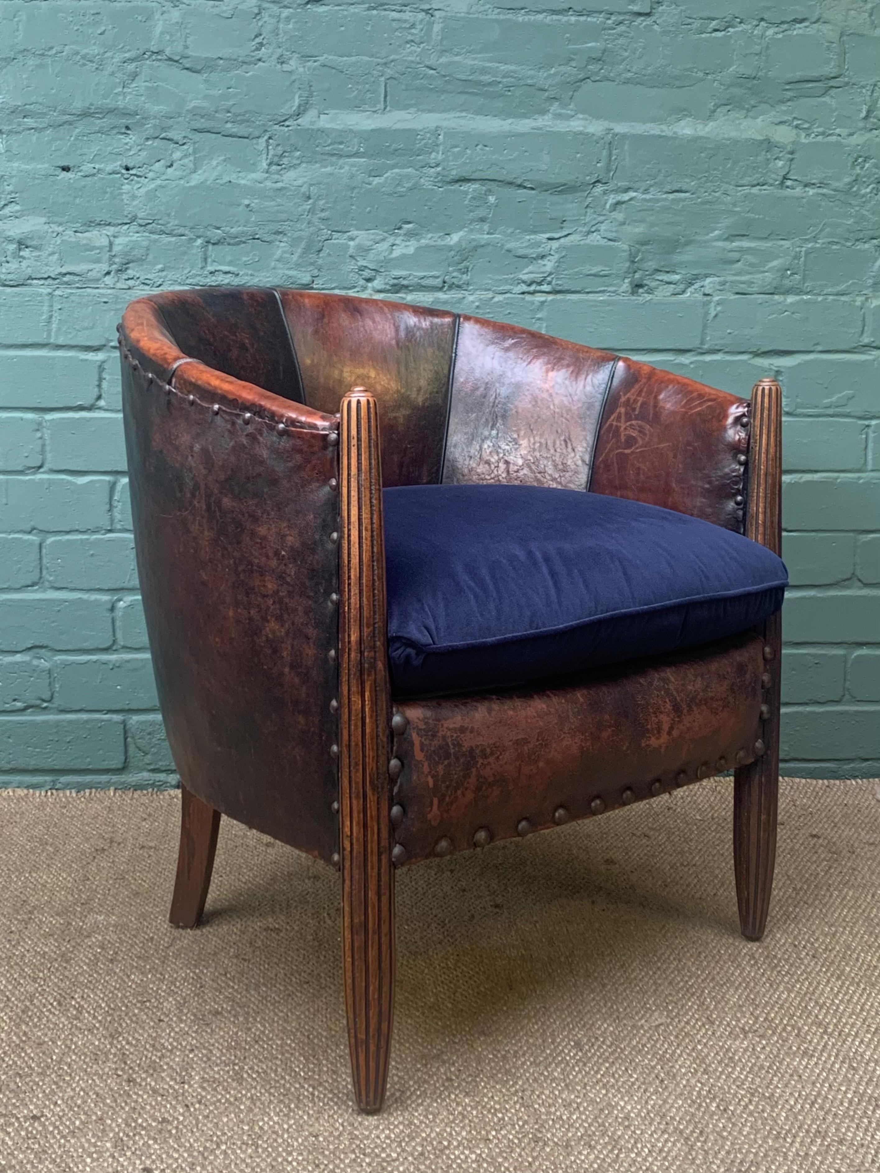 This is a beautiful and very rare chair that still retains its original leather. The  leather is of the highest quality and has therefore stood the test of time. There are no rips or previous repairs and the hand-dyed leather now boasts the most