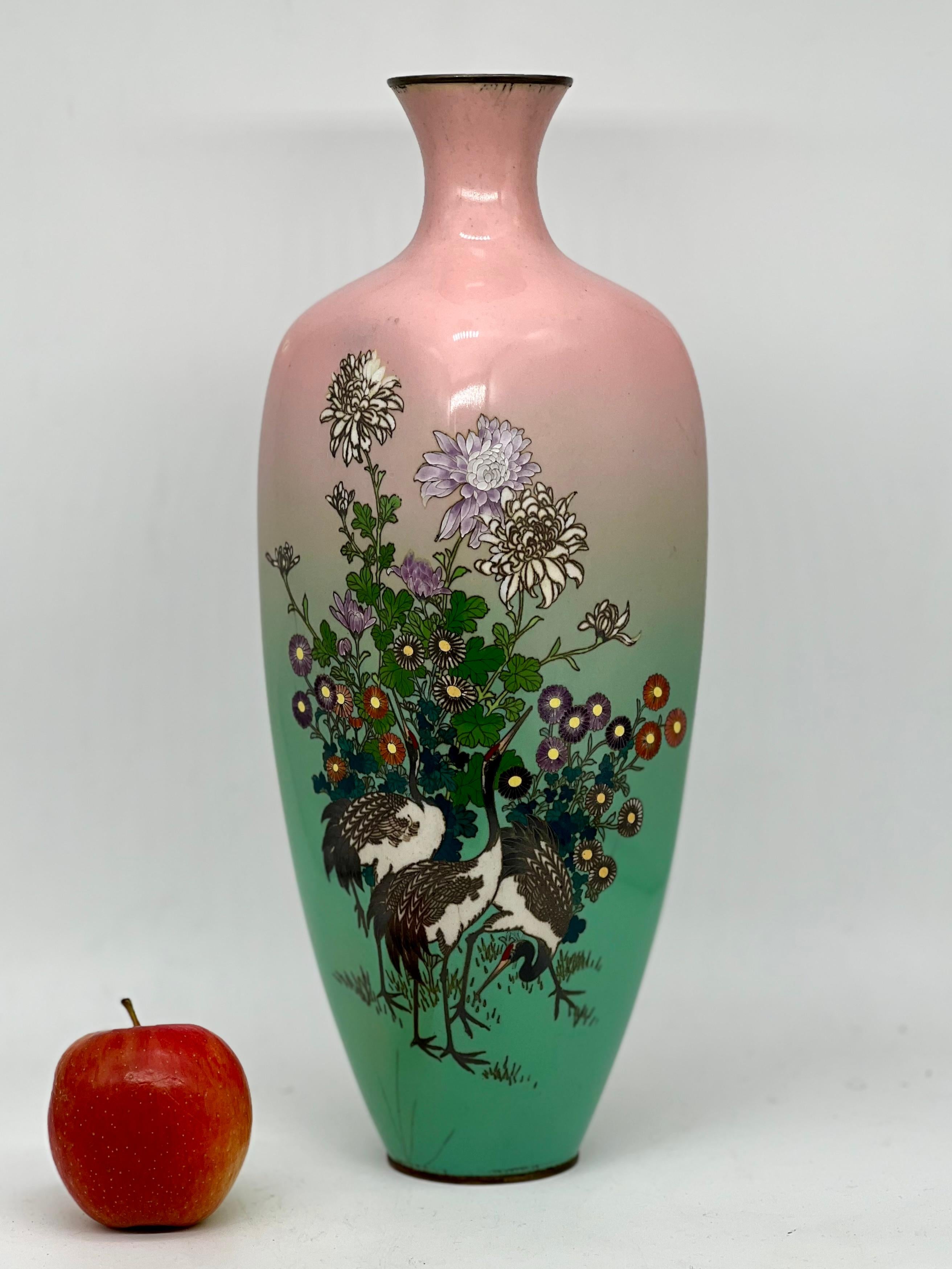 A magnificent Japanese Large Enamel Cloisonne vase of a elegant quadrilateral (square) form with slightly flared neck decorated with fine silver wire and polychrome enamels with three egrets, flowers and foliage reserved on a ground gradually
