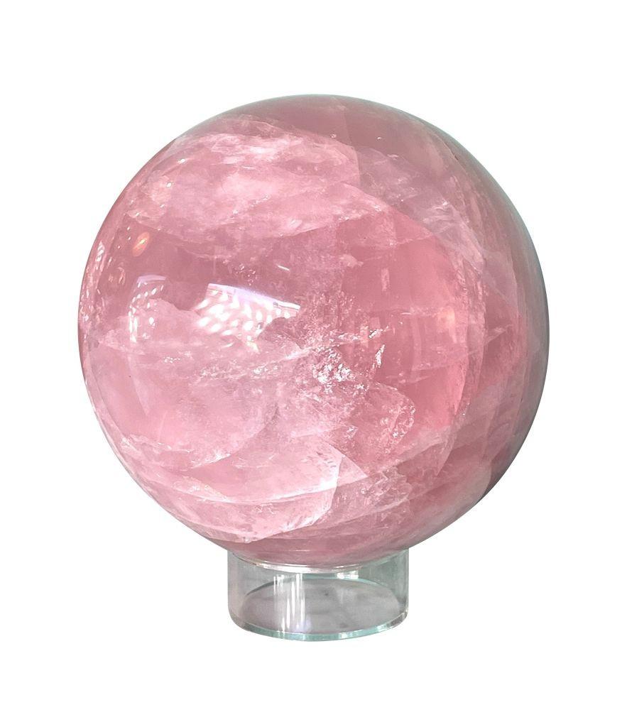 A beautiful large Rose quartz polished sphere from Madagascar on acrylic stand. 
This was originally purchased from Venusrox in Notting Hill, London and comes with original Venusrox label which details the energy properties of Star Rose Quartz:
The