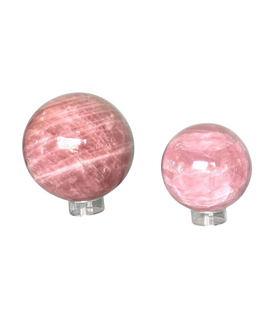 Polished A beautiful large Rose quartz polished sphere from Madagascar on acrylic stand For Sale