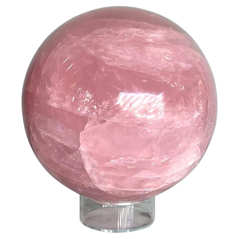 A beautiful large Rose quartz polished sphere from Madagascar on acrylic stand For Sale