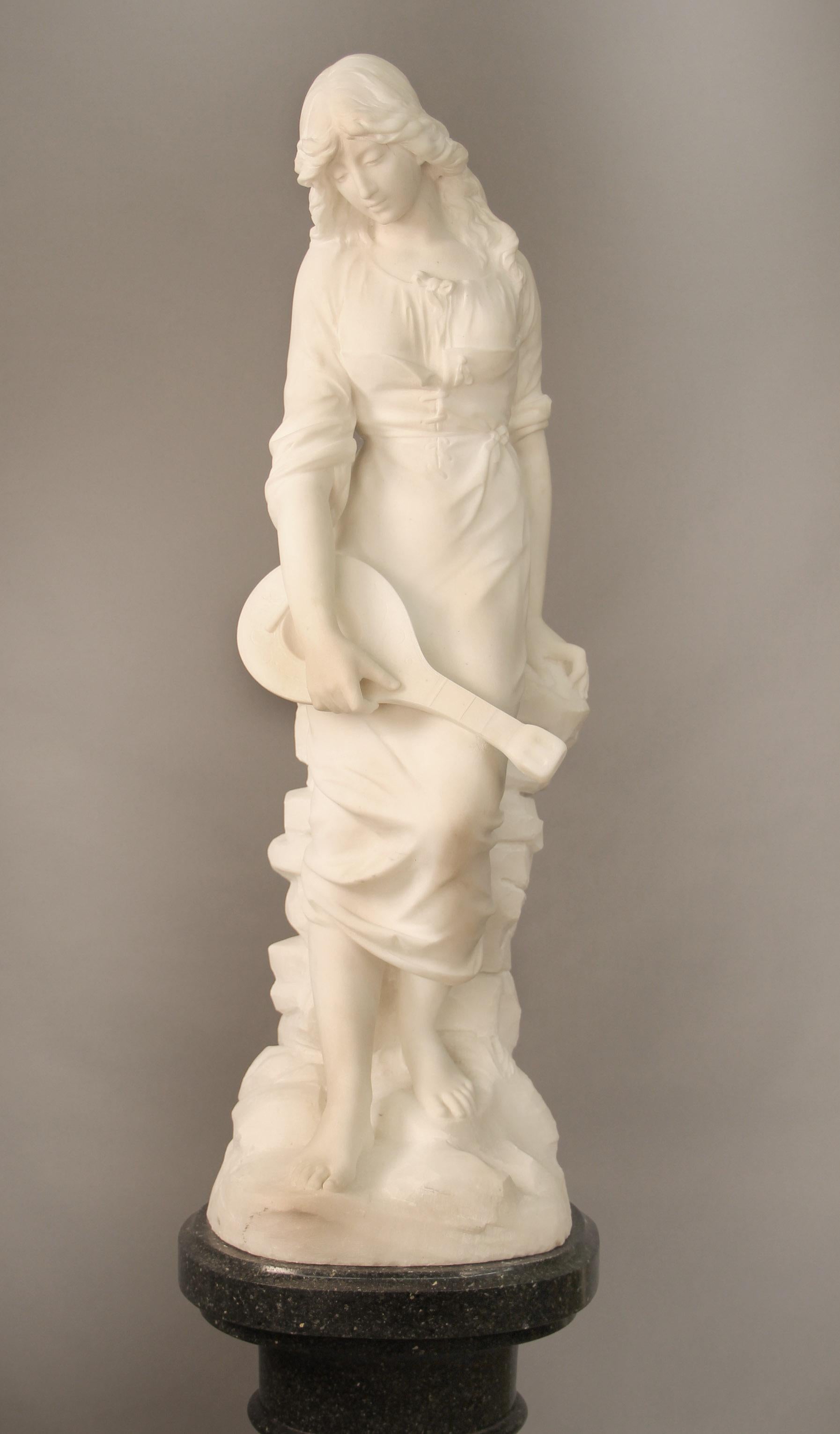 A beautiful late 19th century French white Carrara marble of a woman and her Mandolin

Signed Paul Fournier

Paul Fournier (French, 1859–1926), made many full size and busts of women in the late 19th century. His works are rare and remain