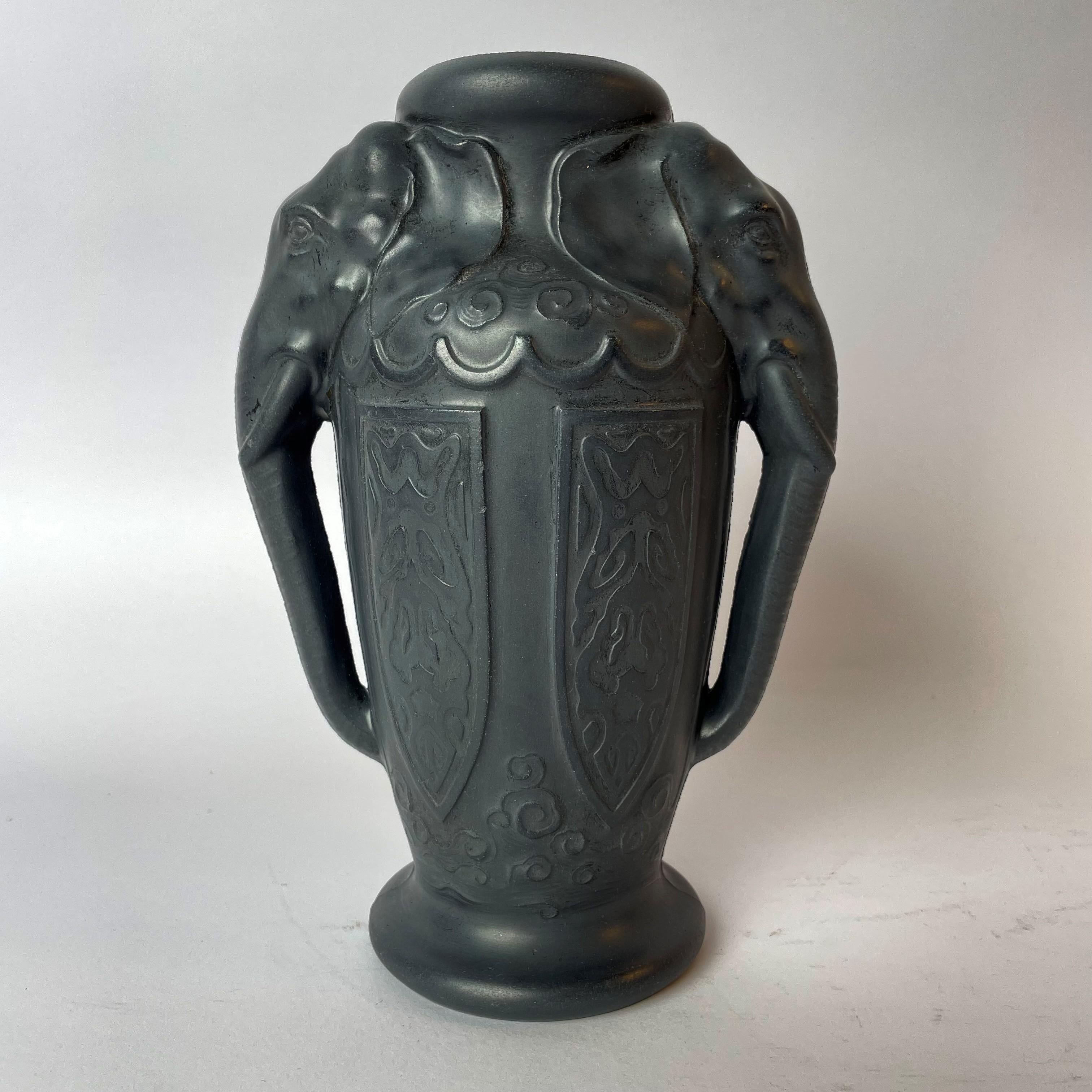A rare and beautiful Lavanite vase decorated with Elephants. Art Nouveau circa 1910. Probably made by W. Henker & Co in Berlin during the 1910s. Marked Lavanit Patent under the vase.


Wear consistent with age and use.