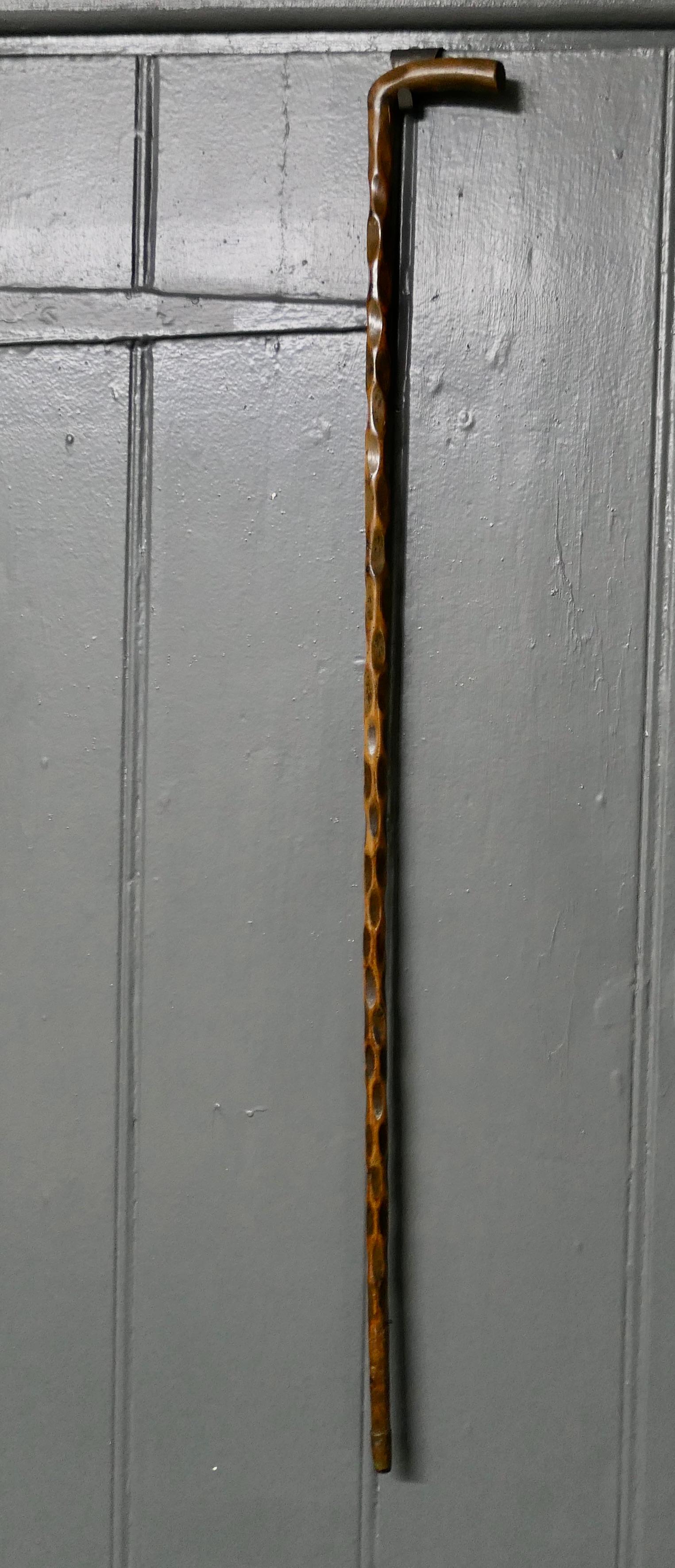 A Beautiful Natural Wood Zig Zag Shaft walking cane 

A Very attractive well loved piece and possibly made from a Vegetable Stalk, the zig zag pattern is very evenly distributed. The cane is elegantly tapering with an integral handle also