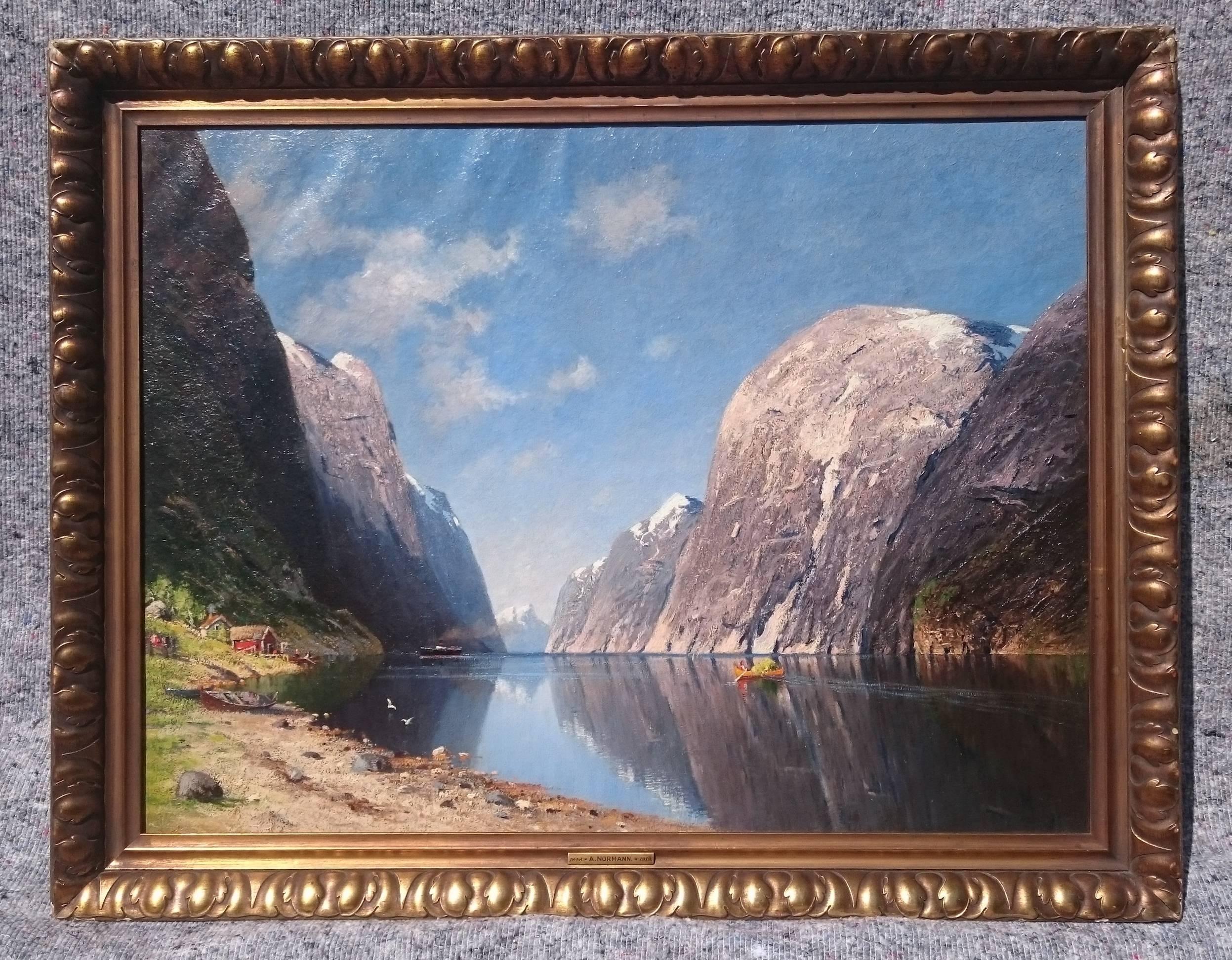 A beautiful Norwegian fjord scene, oil on canvas in the original frame. This is a very detailed painting which gives a wonderful depiction of the space, light and sheer scale of the Fjords. There is a remarkably high level of detail and this is a