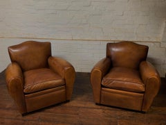 A Beautiful Pair of 1950’s French Leather Club Chairs Chapeau de Gendarme Models