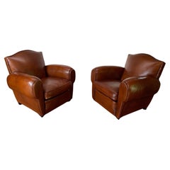 A Beautiful Pair of 1950's French leather Club Chairs Chapeau de Gendarme Models
