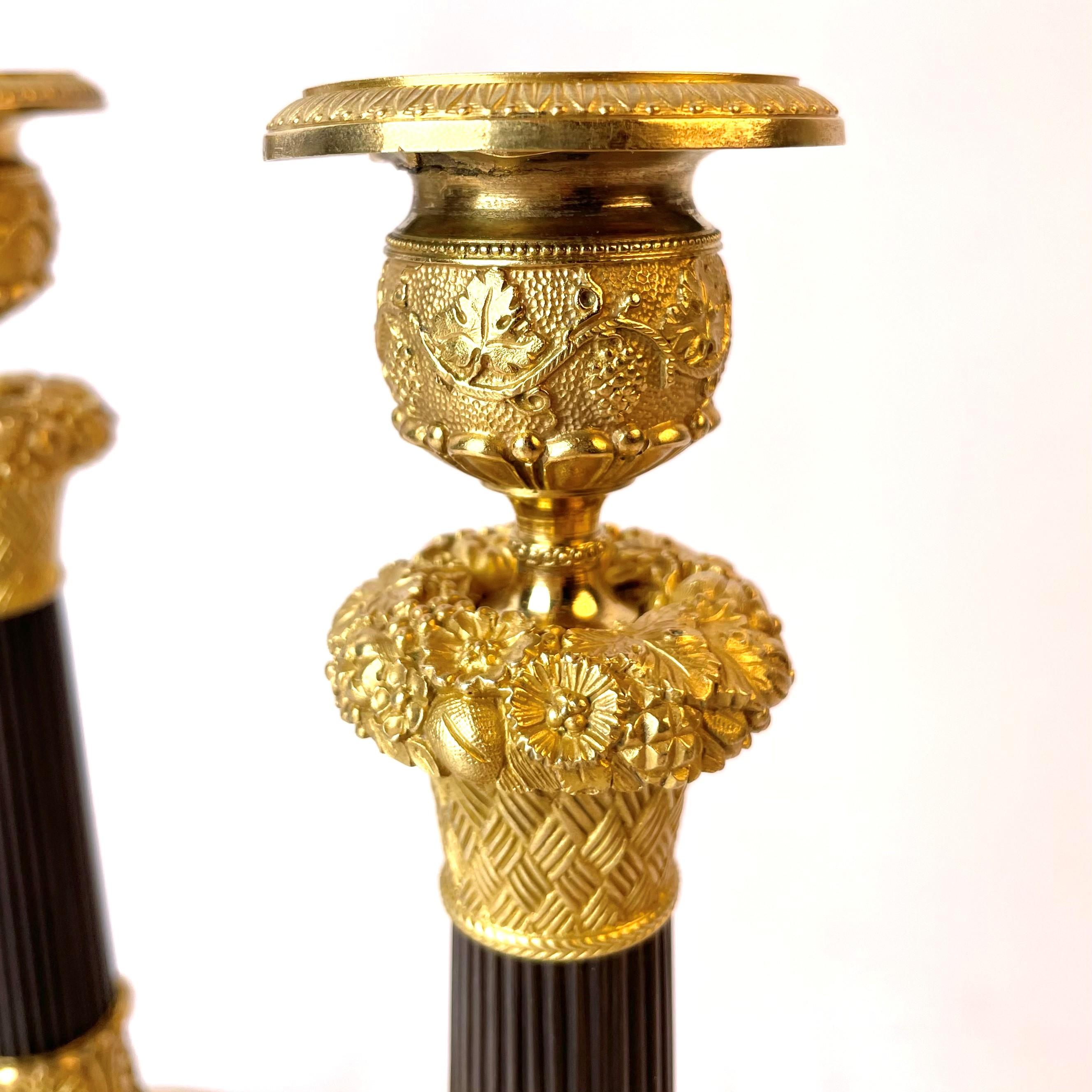 Early 19th Century Beautiful Pair of French Empire Gilt and Dark Patinated Bronze Candlesticks
