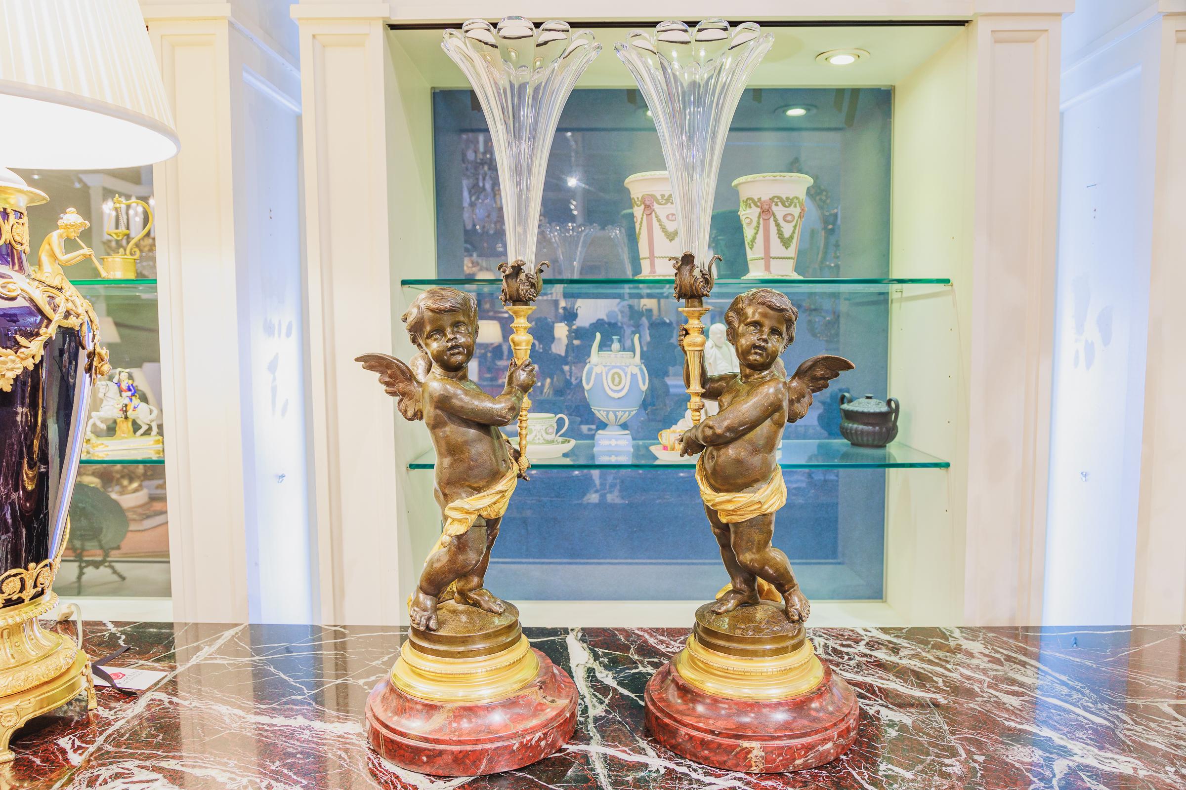 A fine pair of beautiful 19th century bronzes of cherubs with gilt bronze details. Hand blown glass flutes signed Victor Paillard. Beautfiul Griotte marble bases.