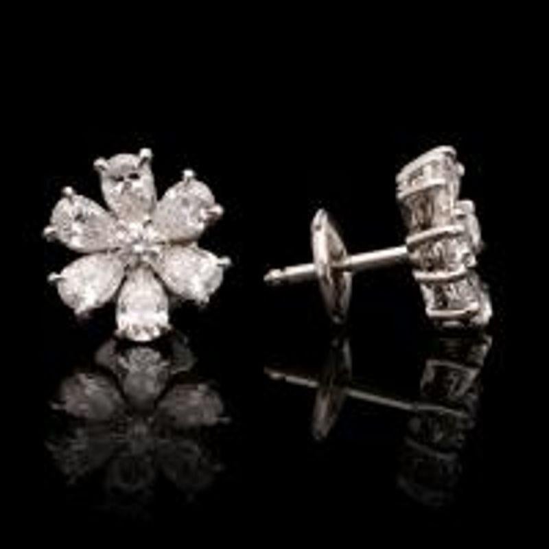 A beautiful pair of platinum and pear-shaped diamond flower head earrings
Hancocks, Contemporary
London
Setting Platinum
Gemstones and Other Materials

12 x G VS pear shaped diamonds with a combined weight of 2.19cts 2 x round brilliant diamonds
