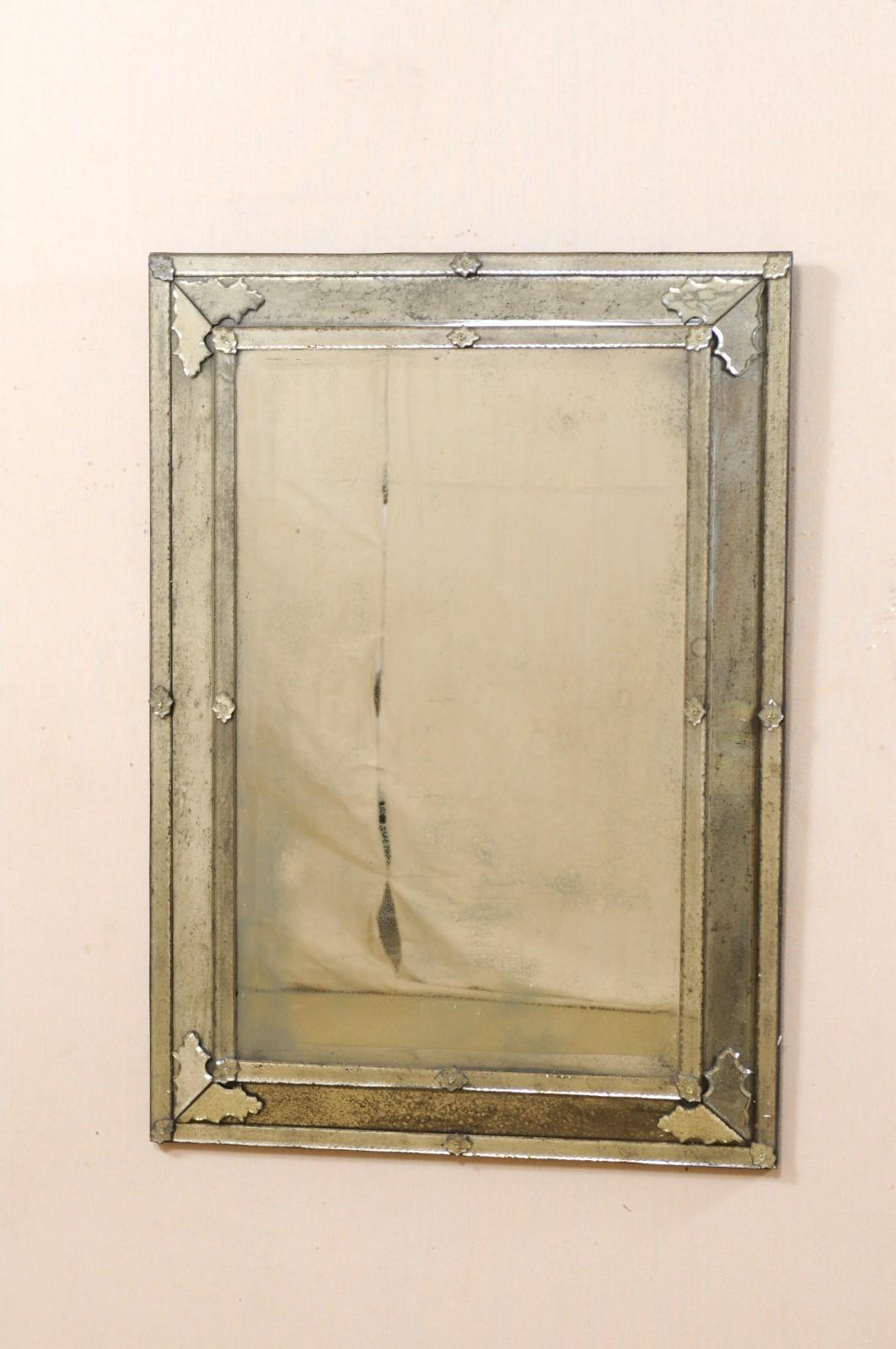 A Venetian style rectangular-shaped mirror, artisan created and hand-silvered. This custom Venetian style mirror (which we refer to as the 
