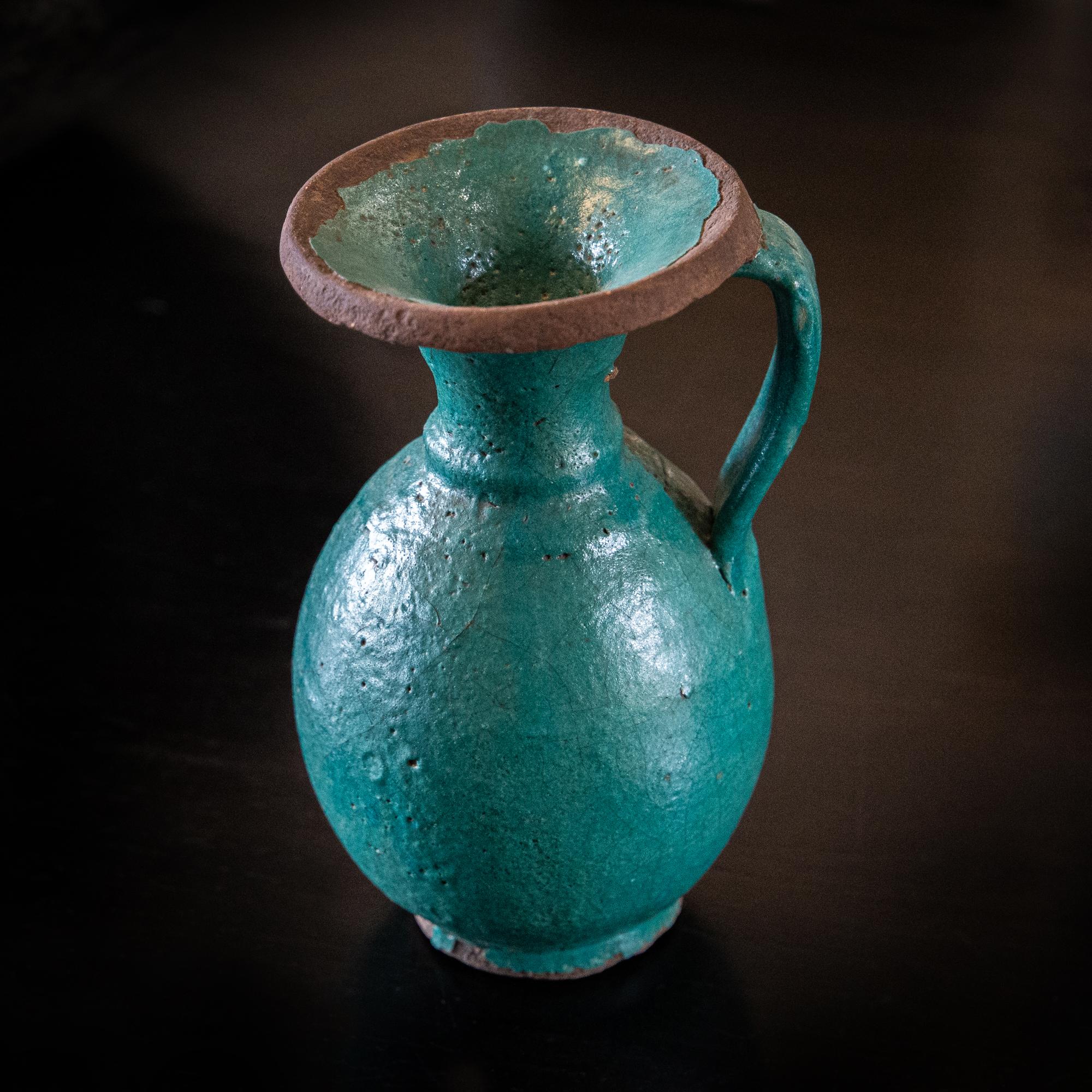 Original Tamegroute eathernware pitcher with vivid iconic deep green glaze specific to this small town on the edge of the Sahara. This version showing the qualities of earlier pieces - the definition and depth of green blue colouration, the