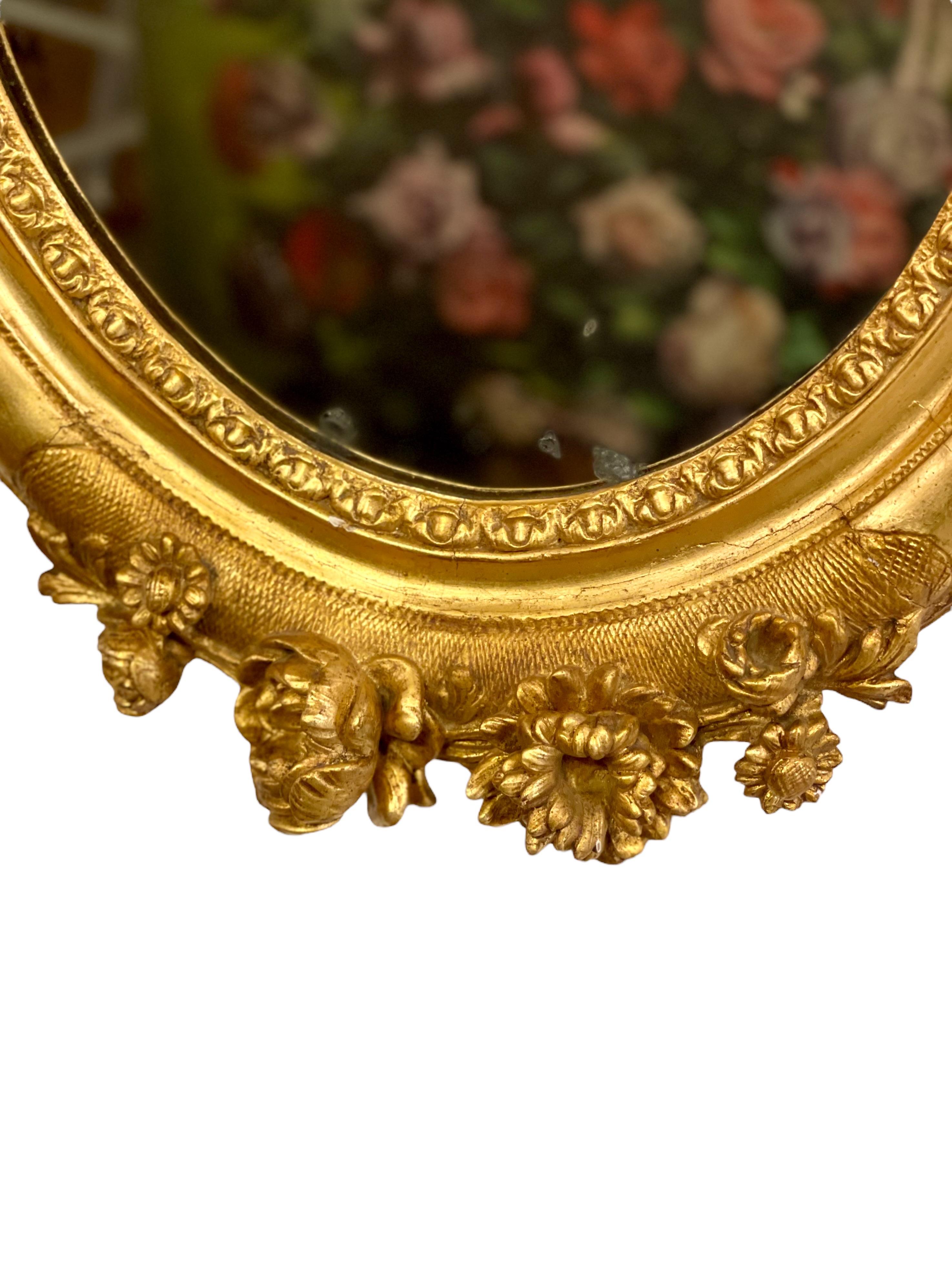 Bois doré Miroir ovale Louis XVI du 19ème siècle en vente
