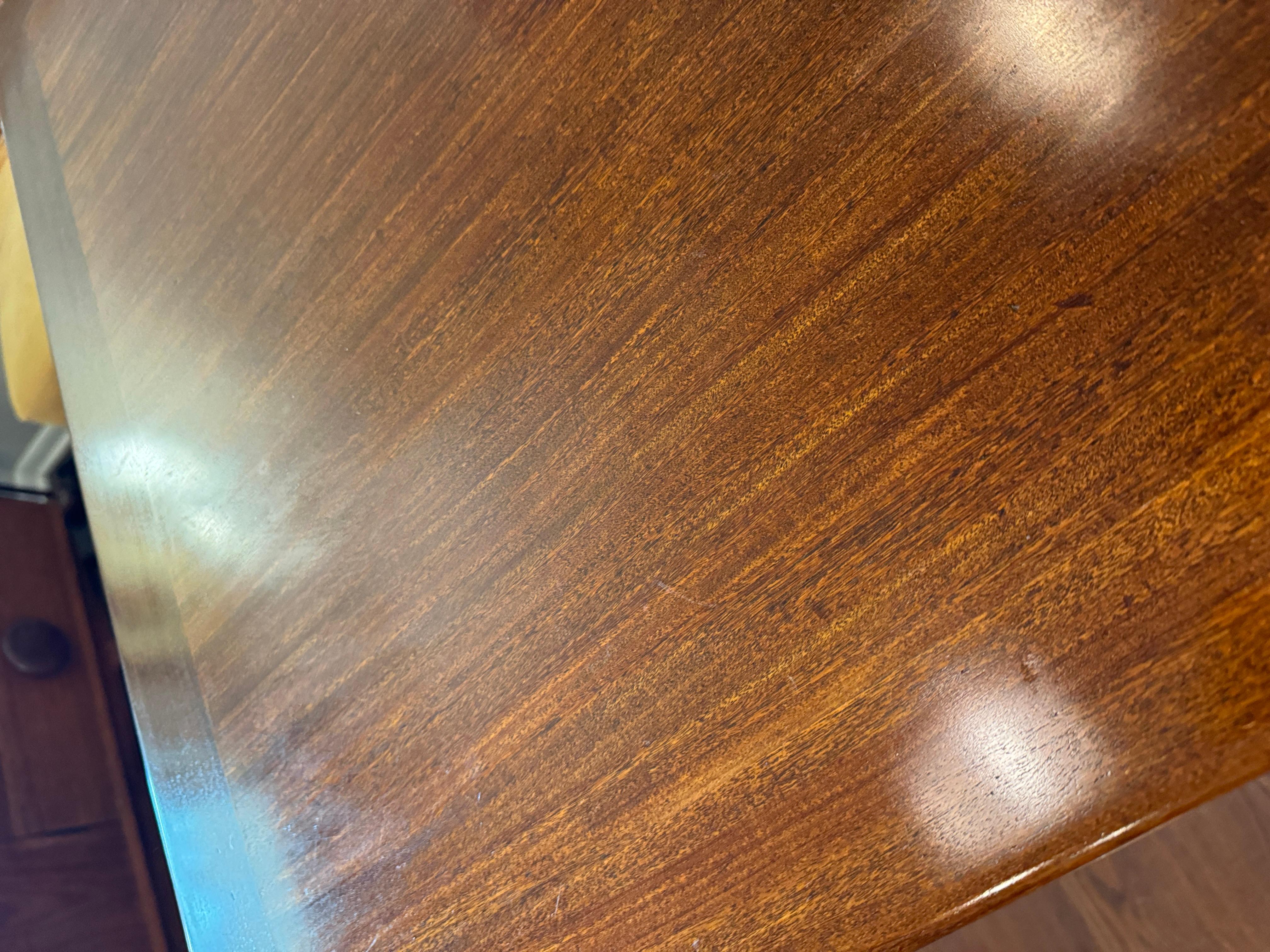 A beautifully designed extending draw leaf dining table designed by John Herbert 3