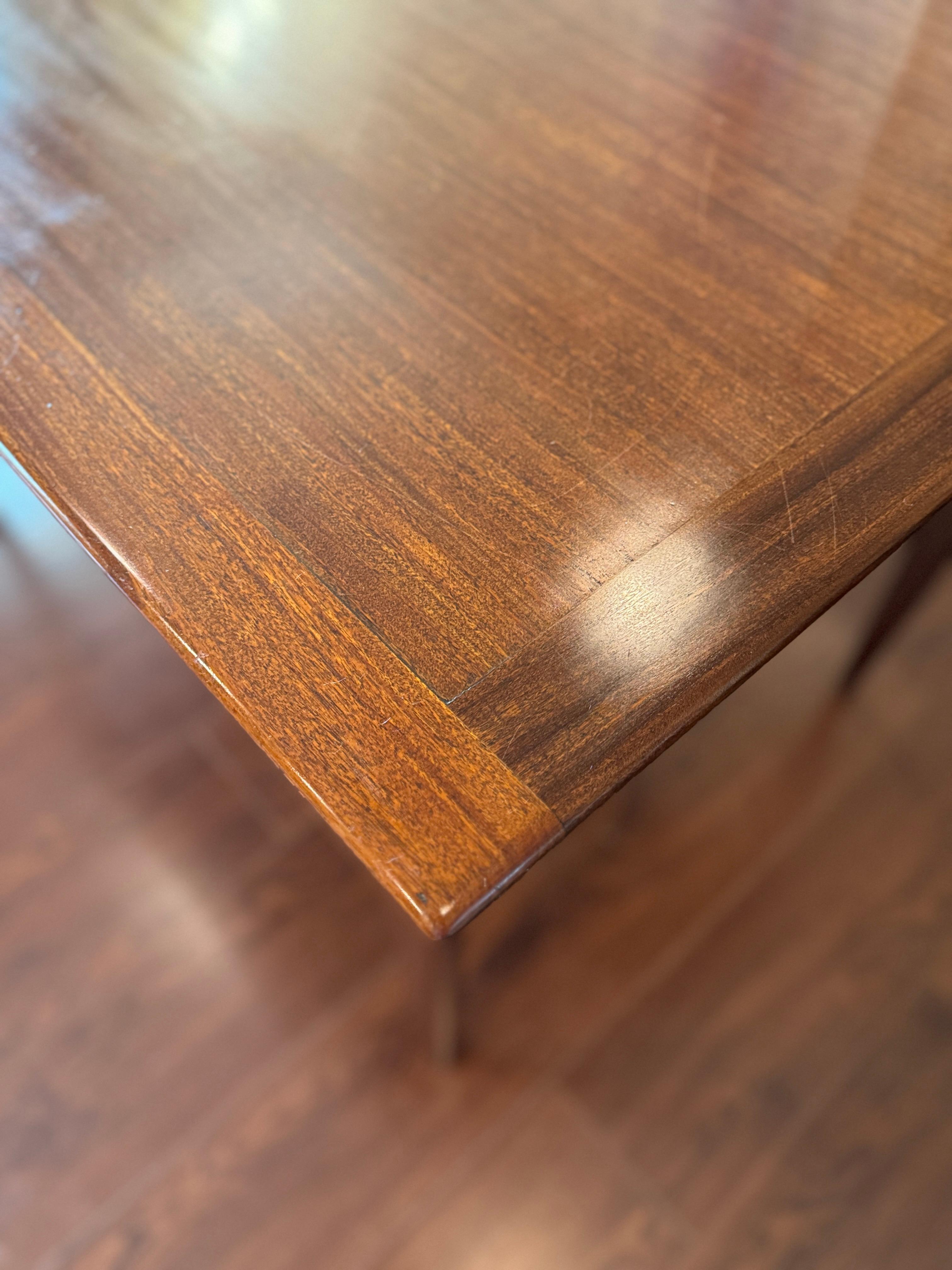 A beautifully designed extending draw leaf dining table designed by John Herbert 5