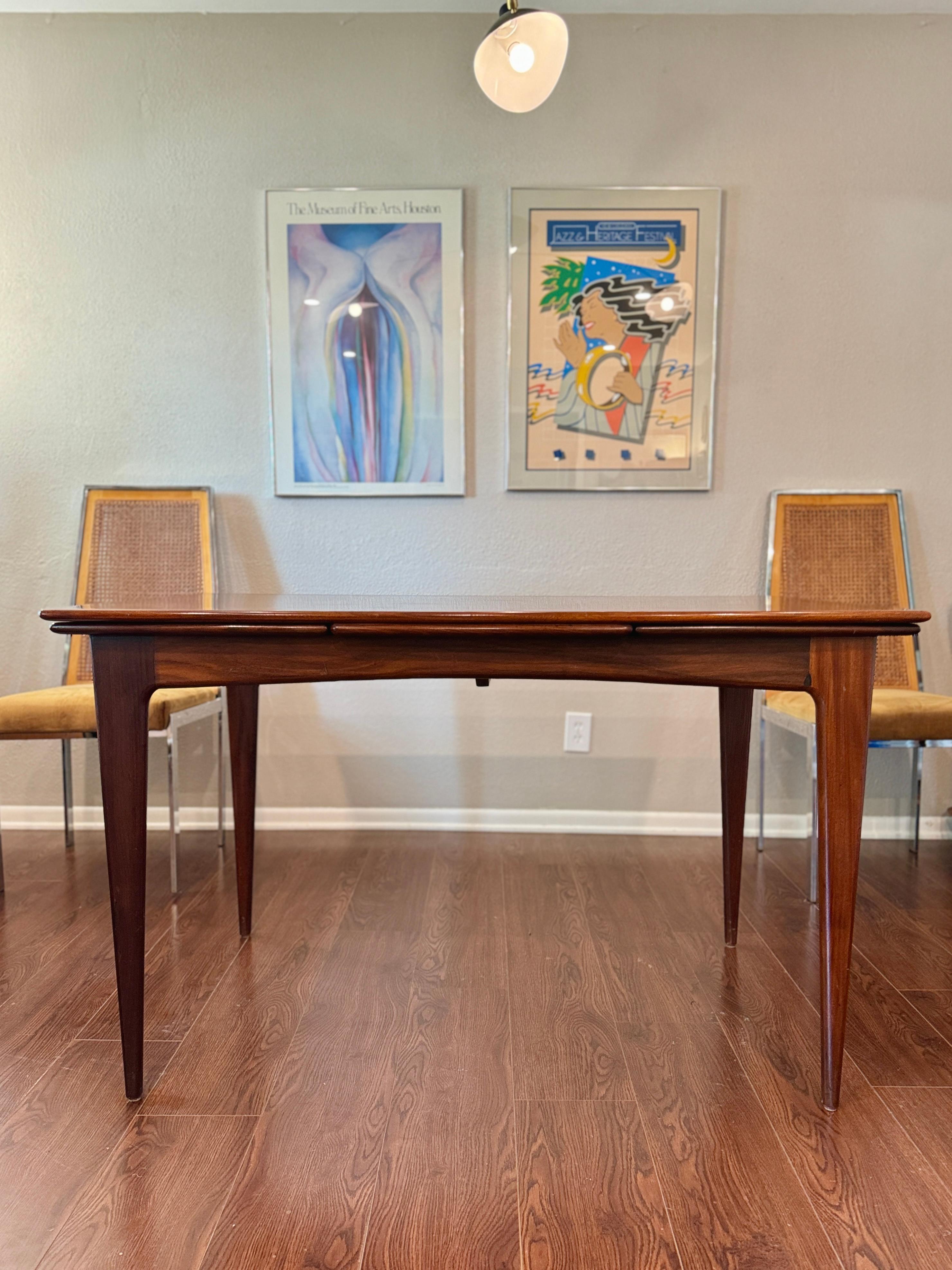 A beautifully designed extending draw leaf dining table designed by John Herbert 6
