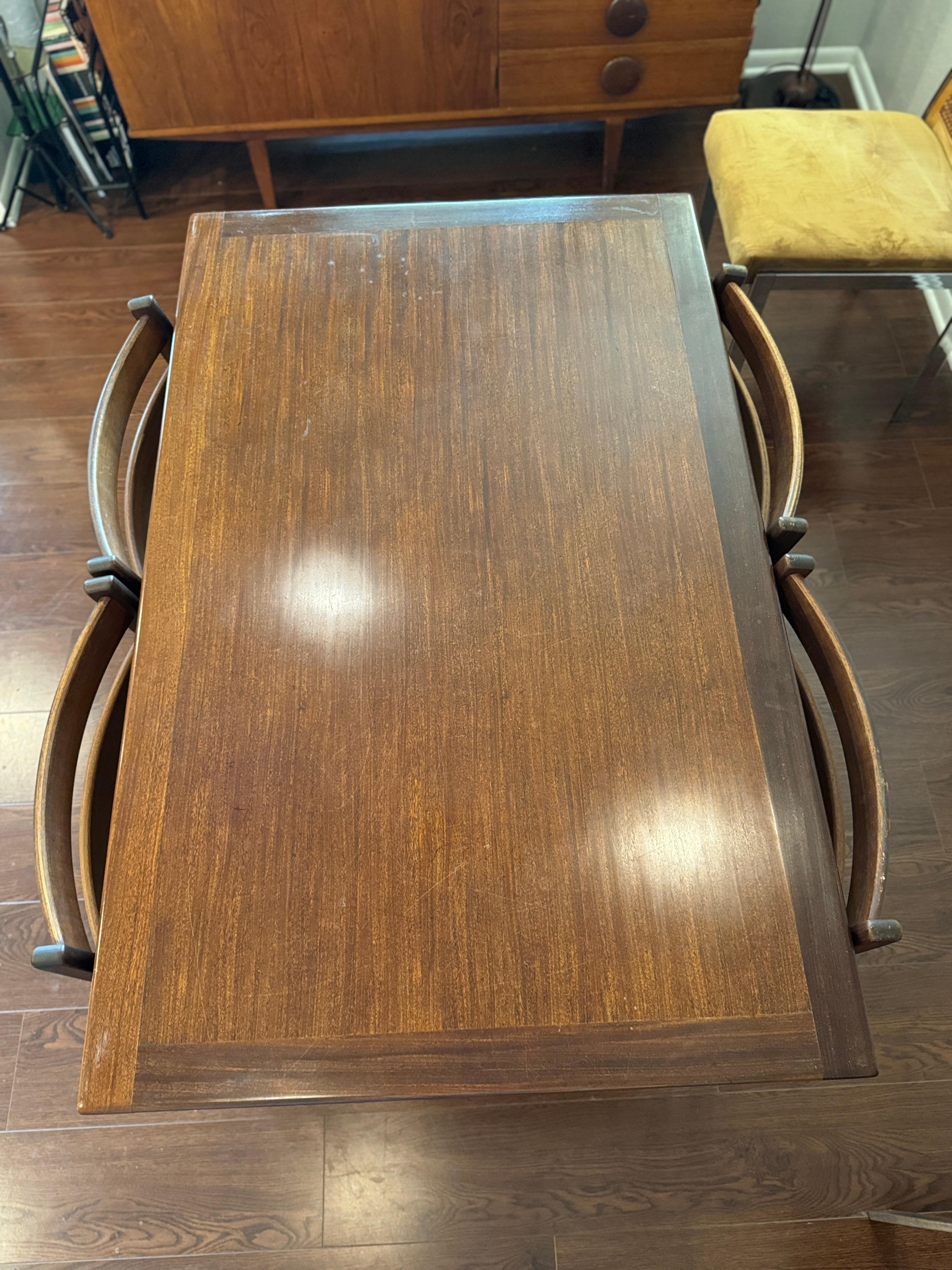 A beautifully designed extending draw leaf dining table designed by John Herbert 9