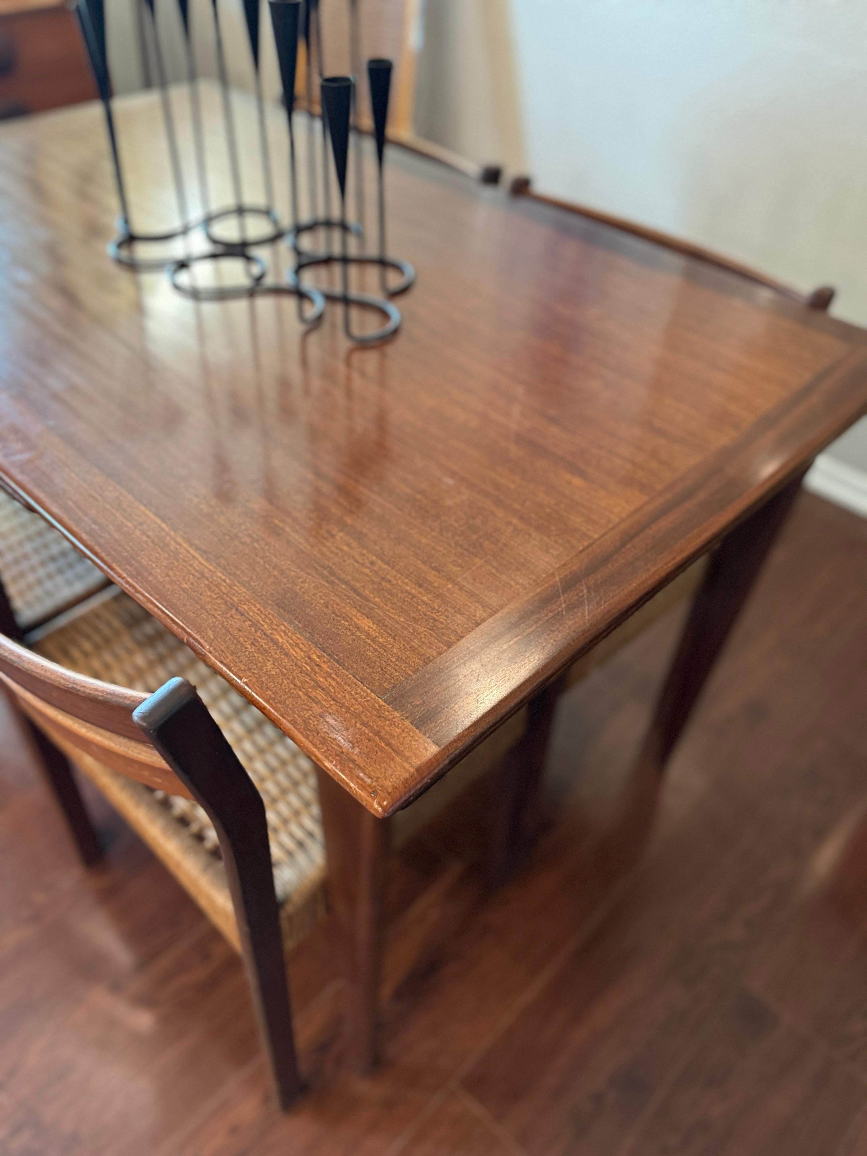 A beautifully designed extending draw leaf dining table designed by John Herbert 10
