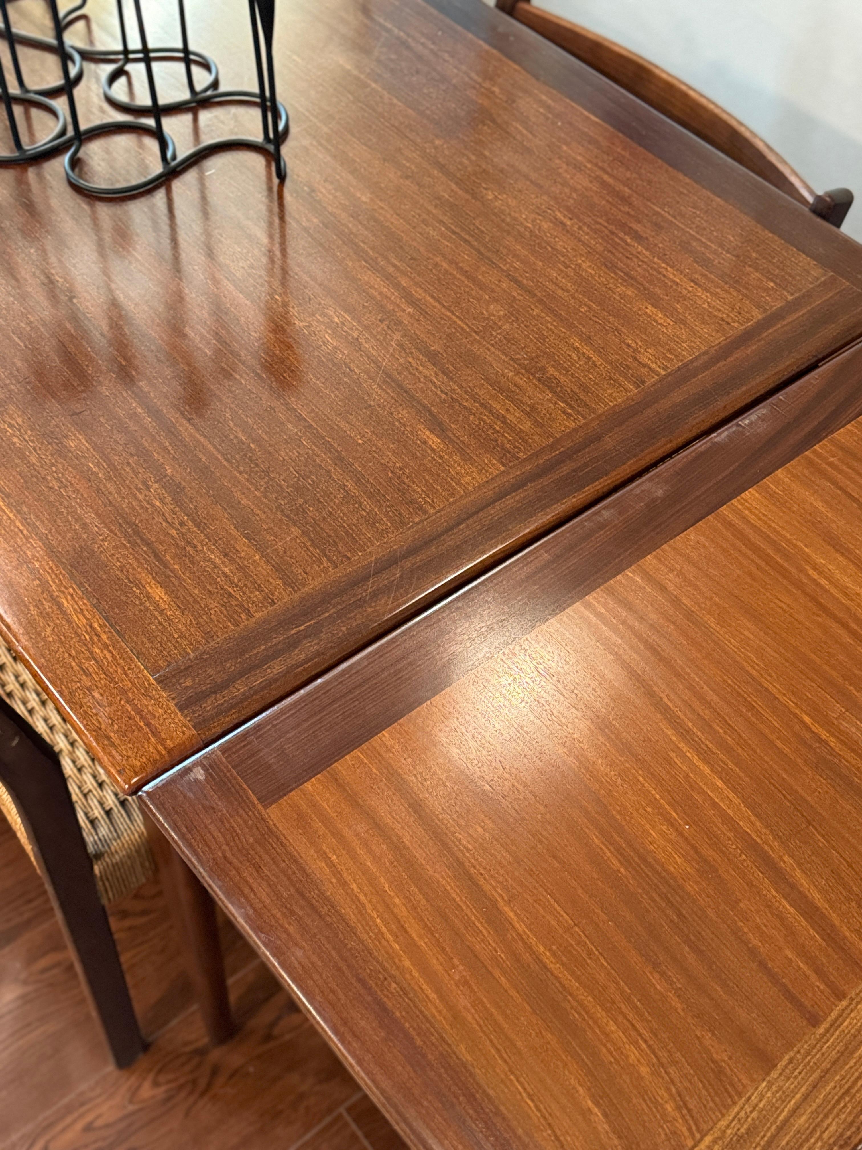 Mid-Century Modern A beautifully designed extending draw leaf dining table designed by John Herbert