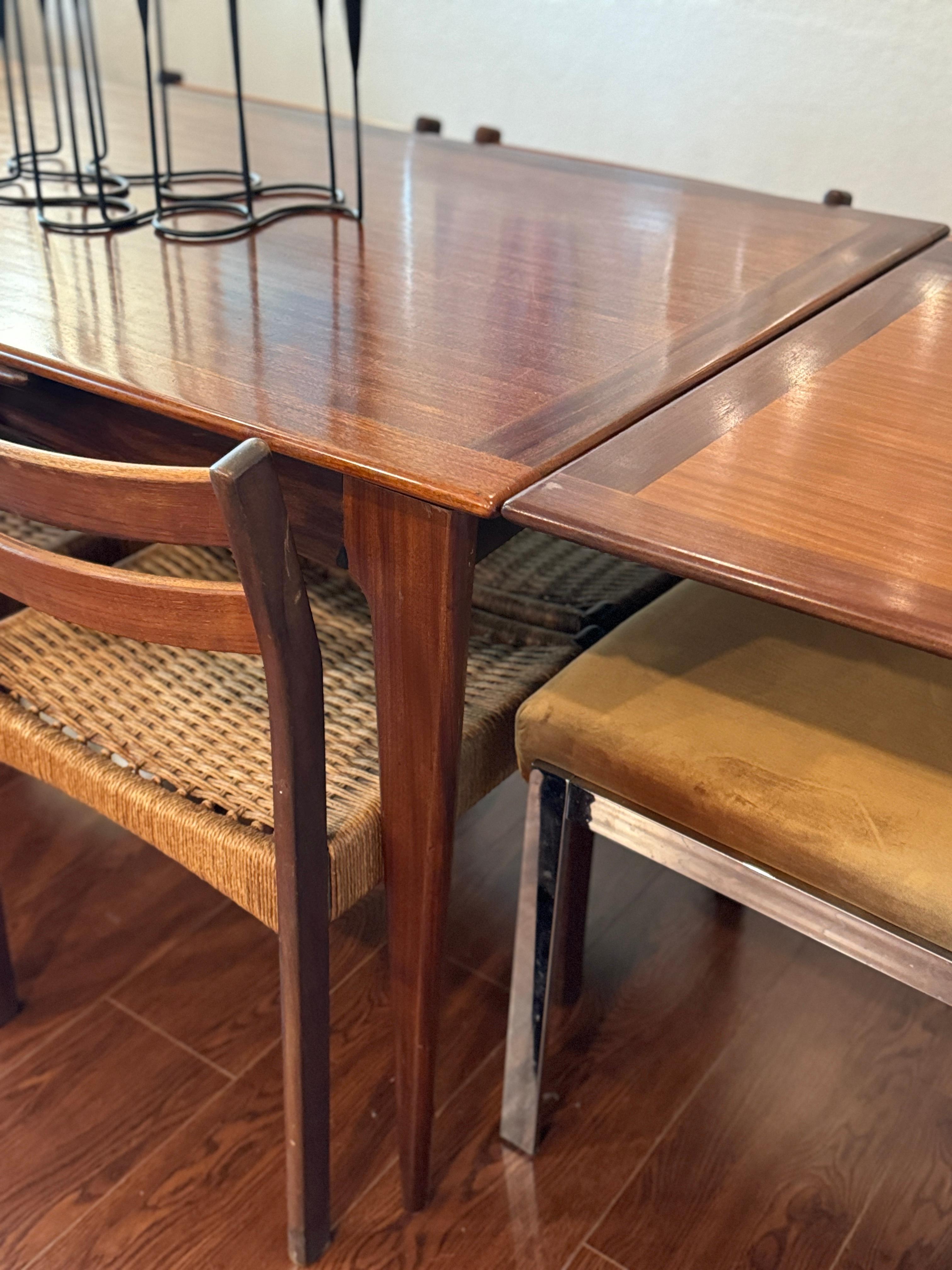 Veneer A beautifully designed extending draw leaf dining table designed by John Herbert